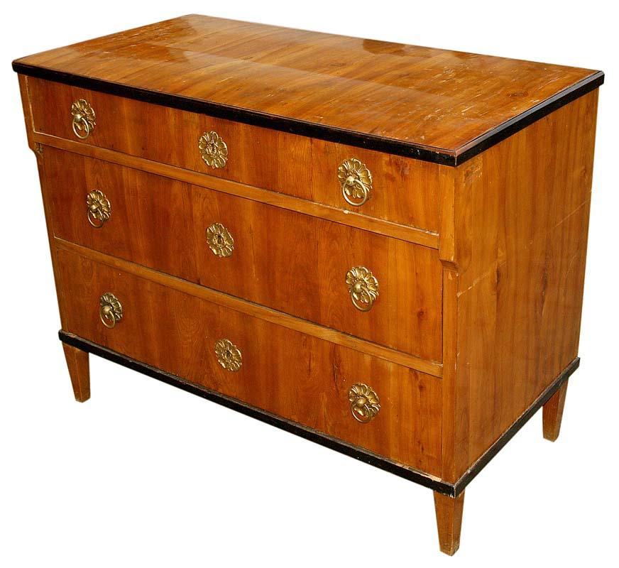 1830 Biedermeier chest of drawers 
A rectangular Biedermeier chest of drawers with three drawers, the upper one is lower and slightly extended to the front. It is supported on four angular, converging legs. The cornice and plinth are edged with a