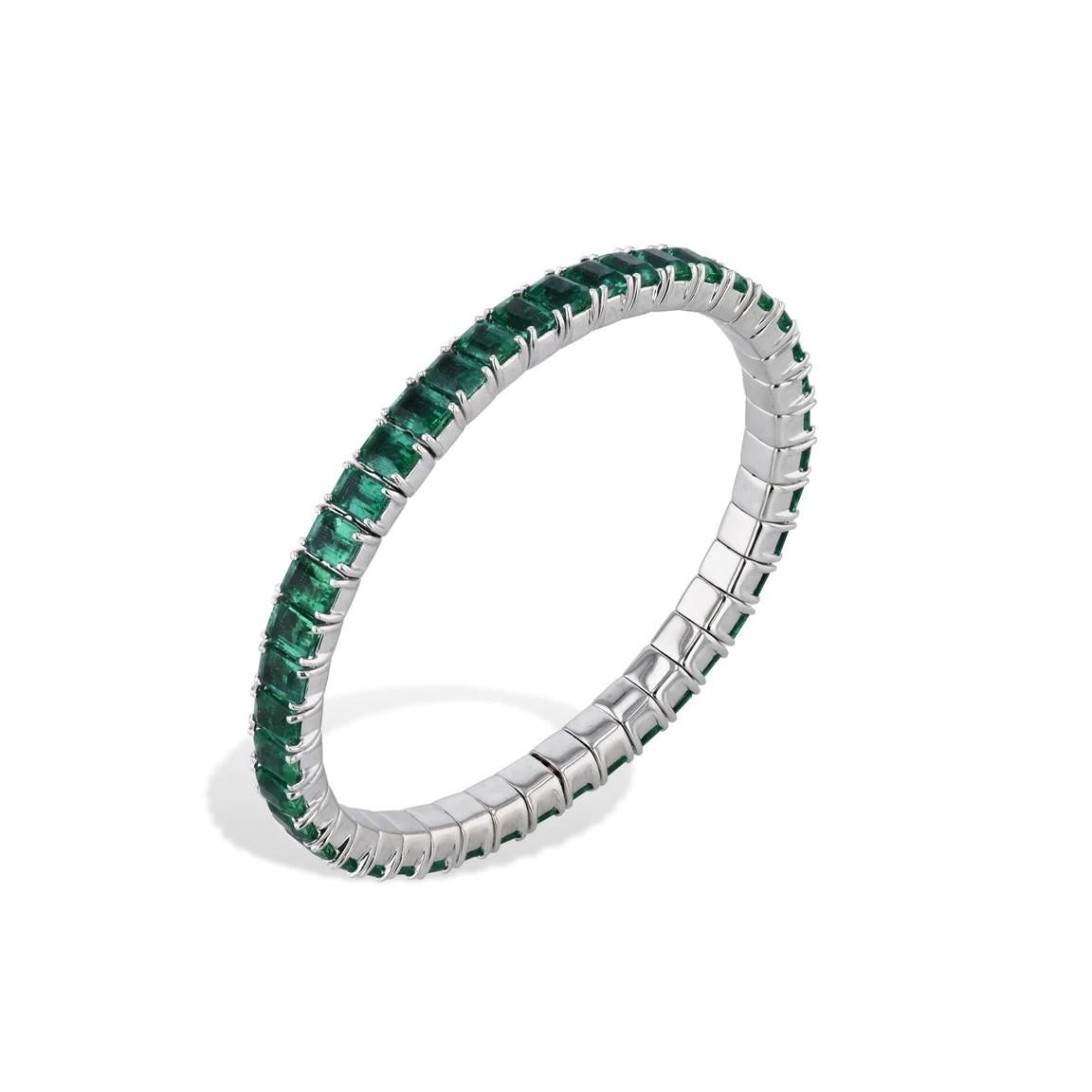 This exquisite 18kt white gold stretch bracelet dazzles with 18.33cts of mesmerizing emerald cut emeralds, in a timeless yet tasteful style. Enjoy effortless on-and-off with its expanding stretching action, and rest assured its outstanding