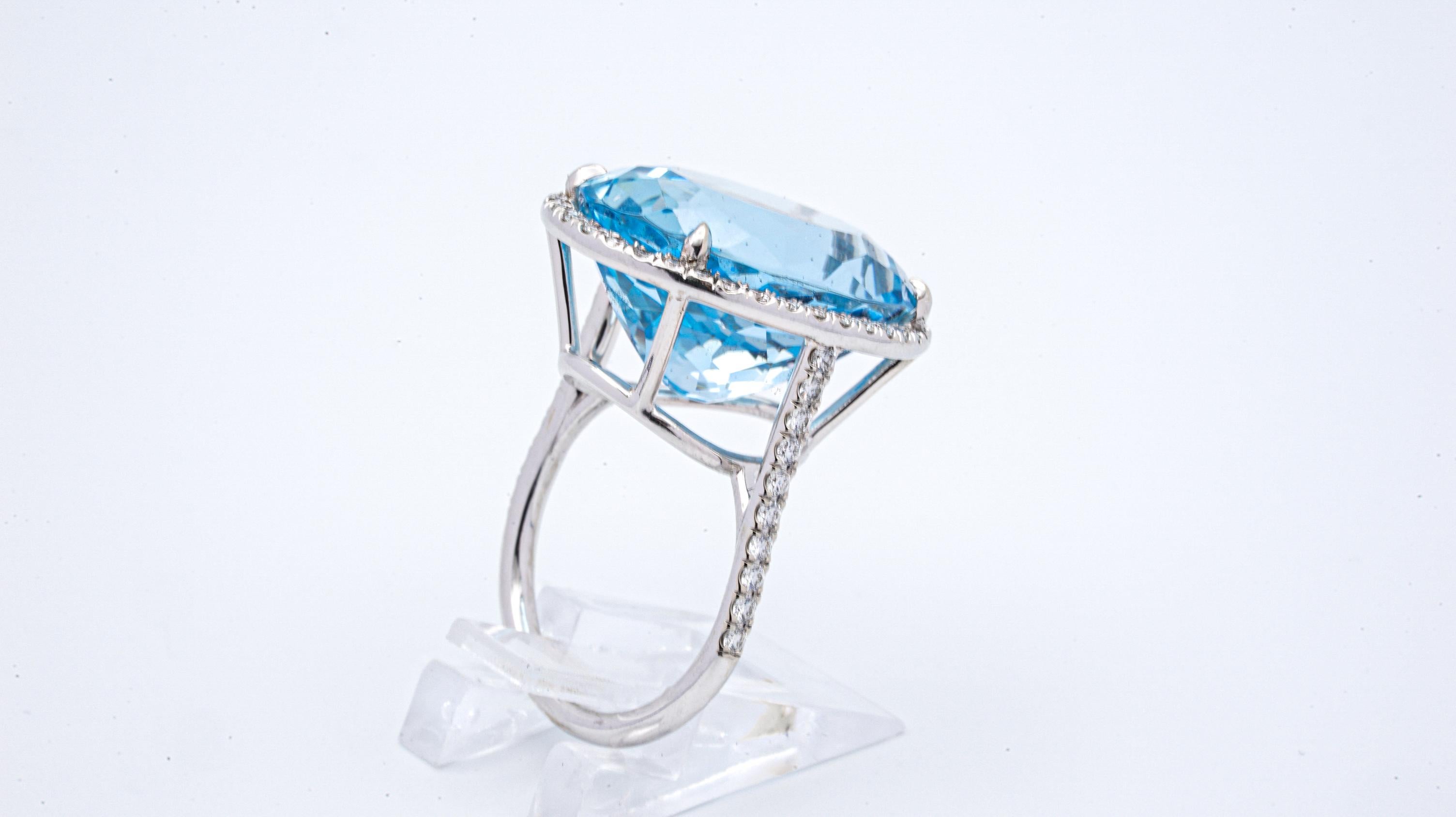 Modernist 18.30 Carat Natural AGL Certified Blue Oval Aquamarine and Diamond Ring