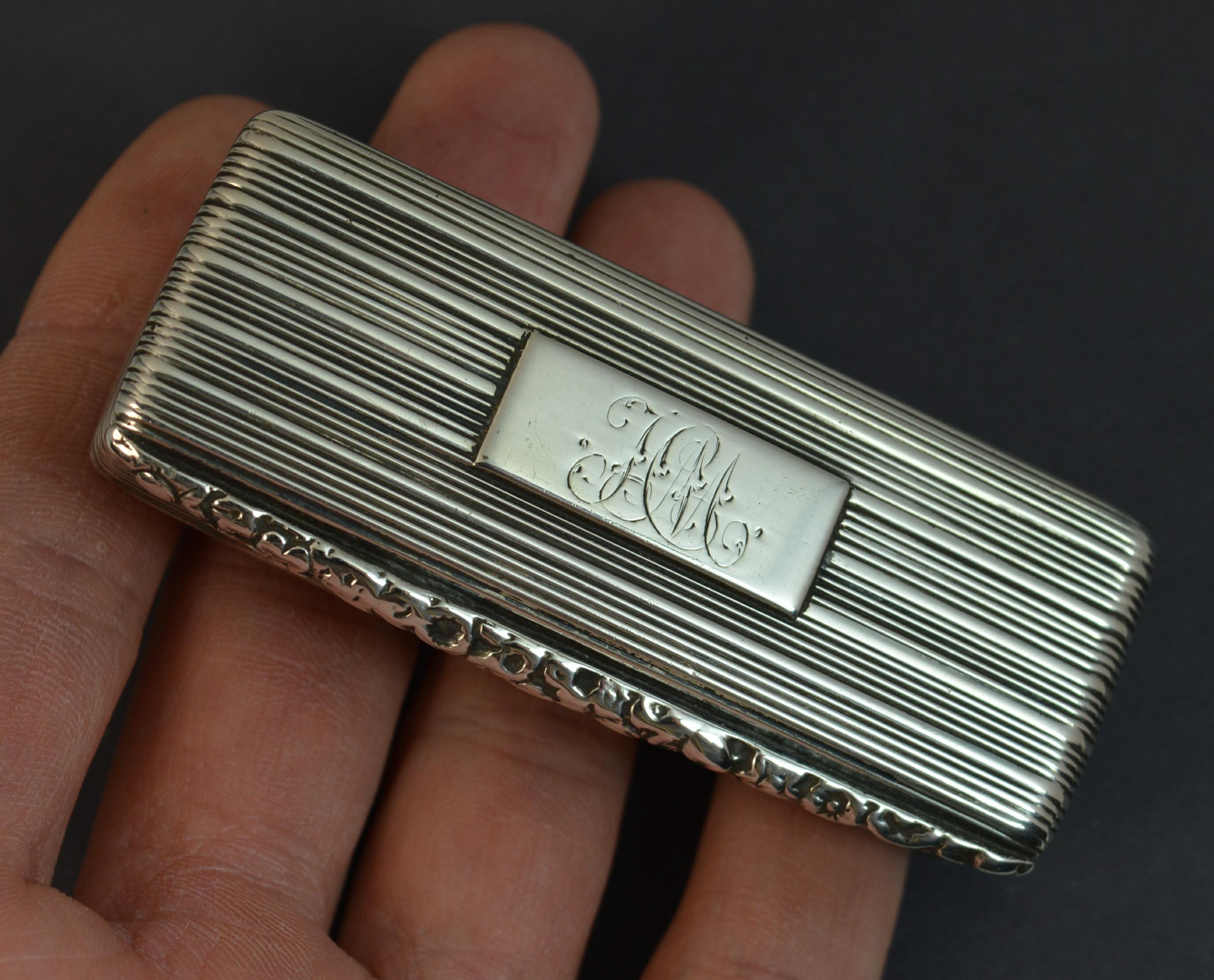 A beautiful solid silver snuff box.
William IV period, English made.
Good gauge, shape and size.
Ridged finish throughout with a floral relief finish to the lid section. Cartouche with HM initials.

Hallmarks ; full hallmarks to inside, Thomas Shaw