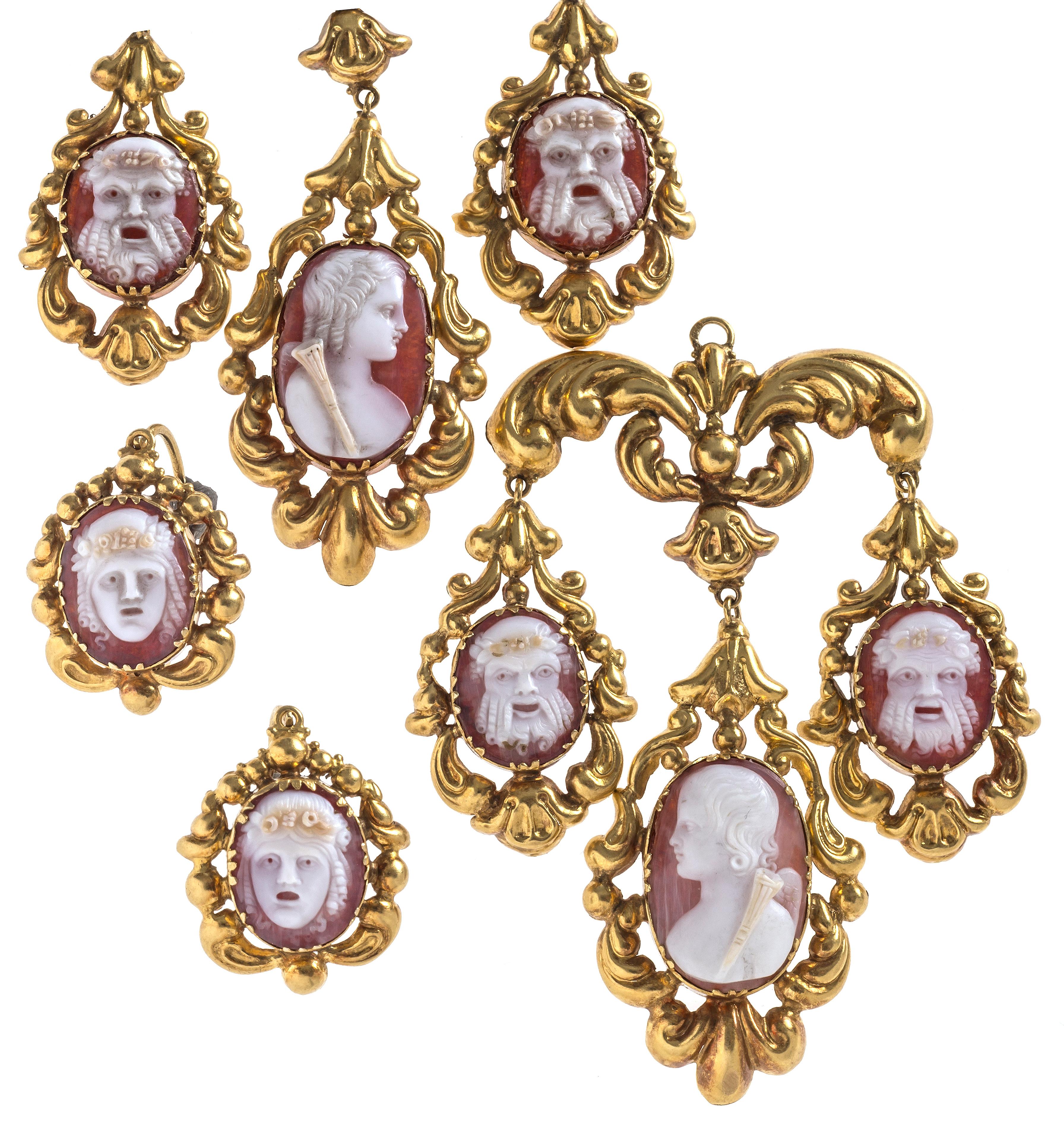 Fabulous chandelier earrings made of shell cameo with detachable tops. Each earring has one larger oval cameo depicting cupid in profile and three cameos showing greek and roman theatre masks. The tops have the original back to front hooks. The