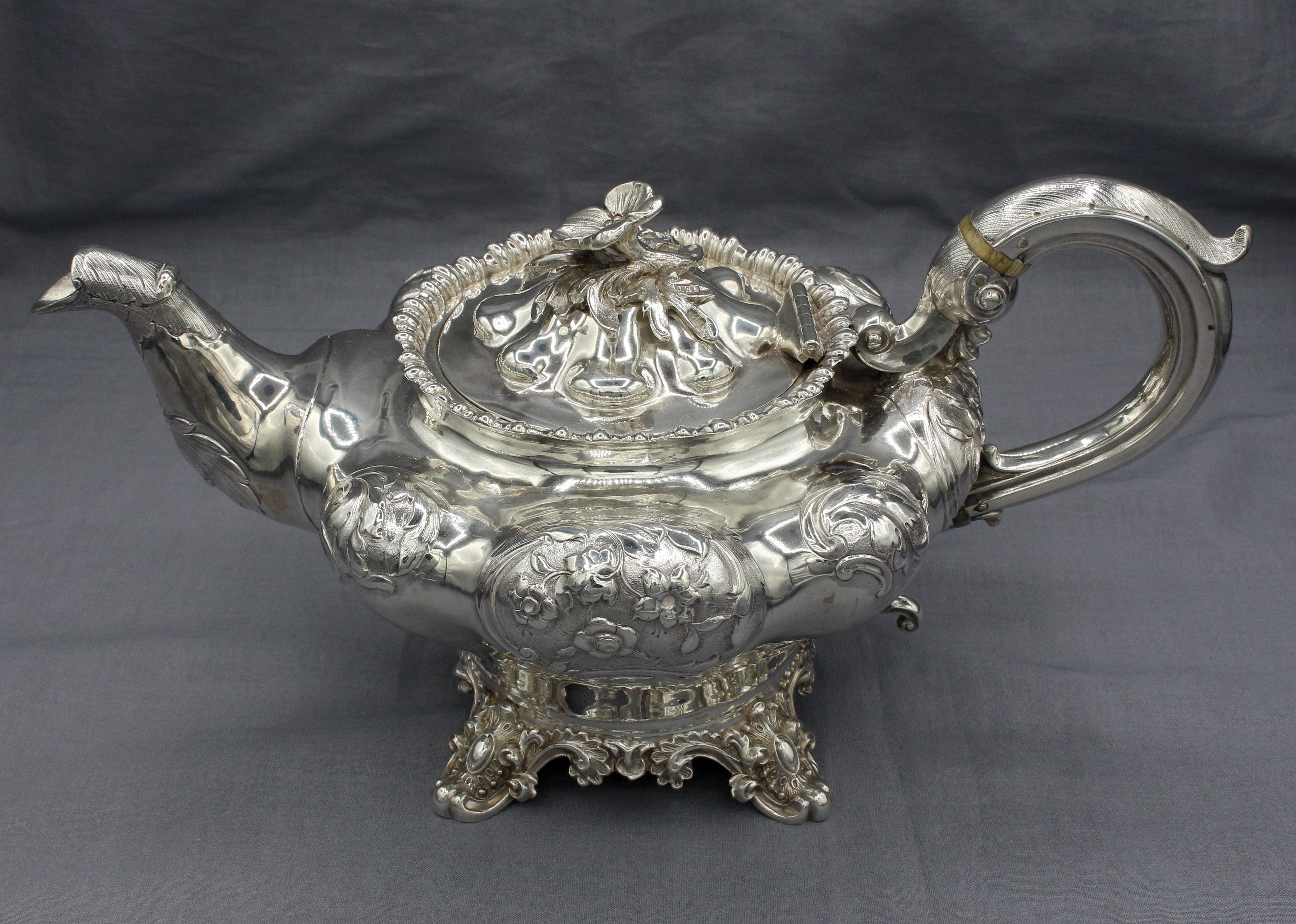 1839 & 1839 Sterling Silver 3-piece Tea Set, London, England. Handsome Rococo Revival design of the early Victorian era. Made by John Edward Terrey. The pot with 1838 mark & the cream & sugar with 1839 mark. Scrolled feet & lovely flower finial.