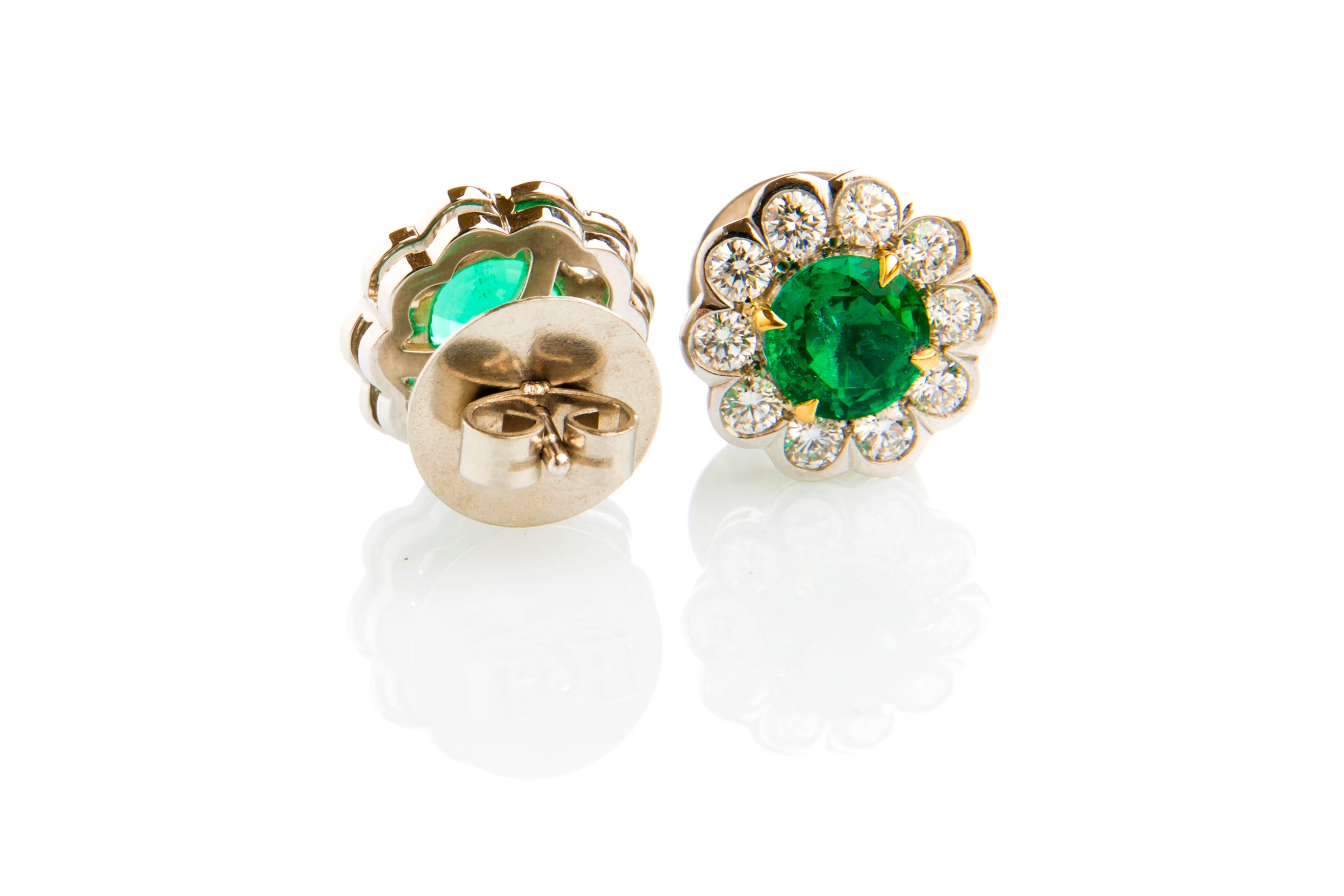 flower shaped pair of round emerald and round diamond cluster earrings 
2 Zambian Emerald (no oil) 1.83ct
20 round diamonds 1.13ct
18k white gold
come with studs
