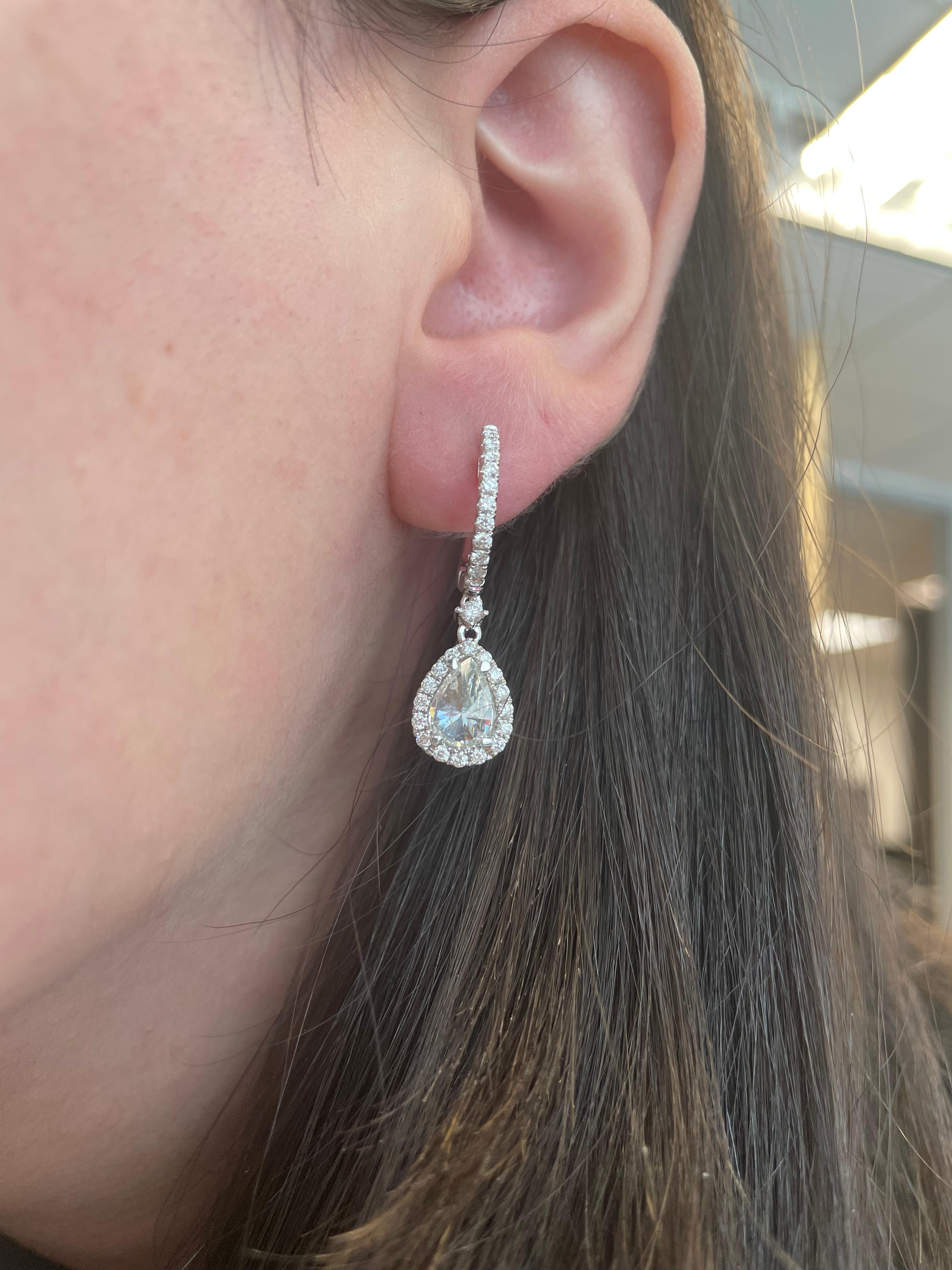 Unique old mind cut upside down diamond drop earrings.
2 pear shape old mine cut diamonds, 1.83 carats. Approximately G/H color and SI clarity. Complimented by 56 round brilliant diamonds, 0.85 carats. Approximately G/H color and SI clarity. 18k