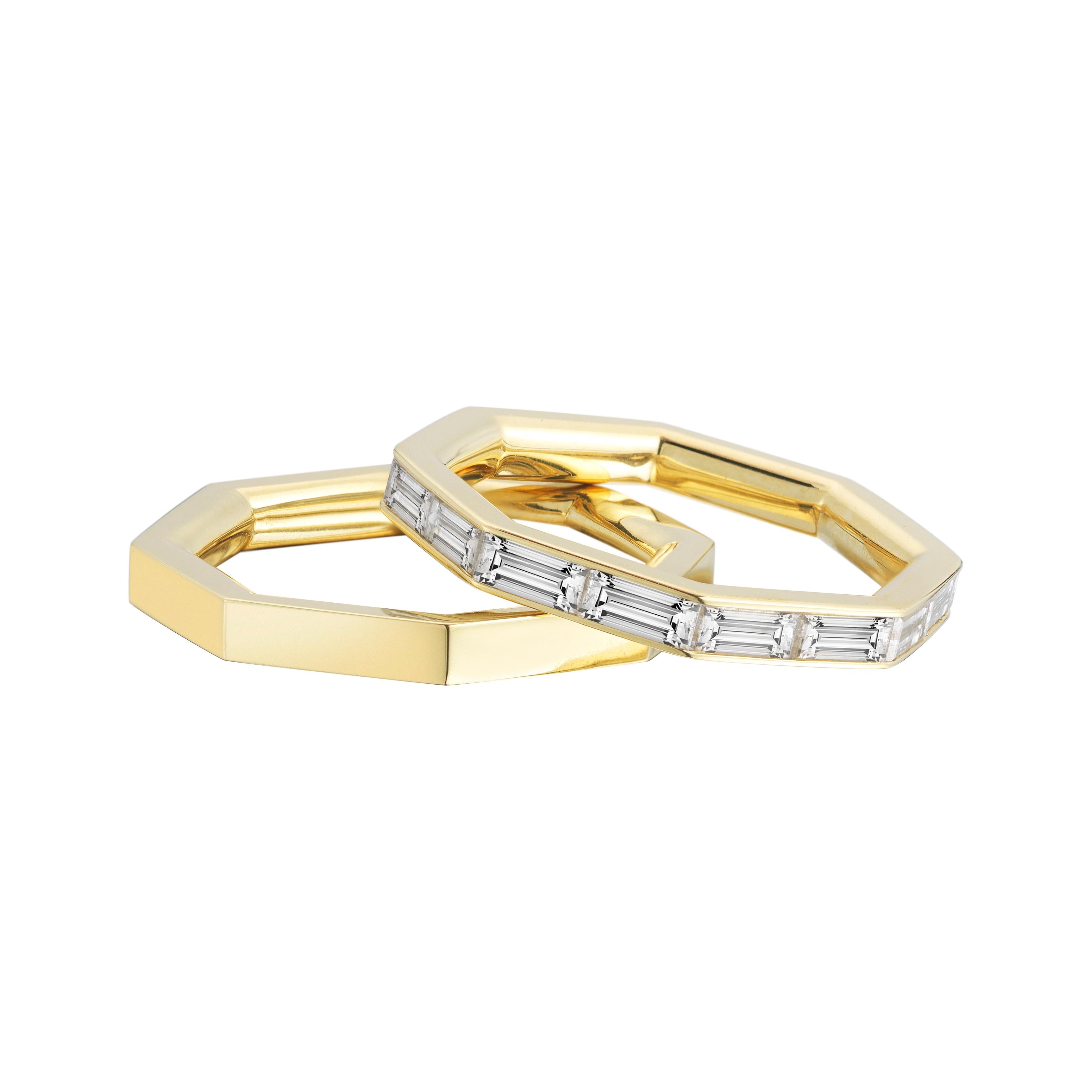 A gorgeous 1.85 carat baguette eternity band in 18k yellow gold. The shape is what sets it apart. That and the superior quality of the diamonds which were custom cut just for this piece. The angles continue from the outside in. This is a very