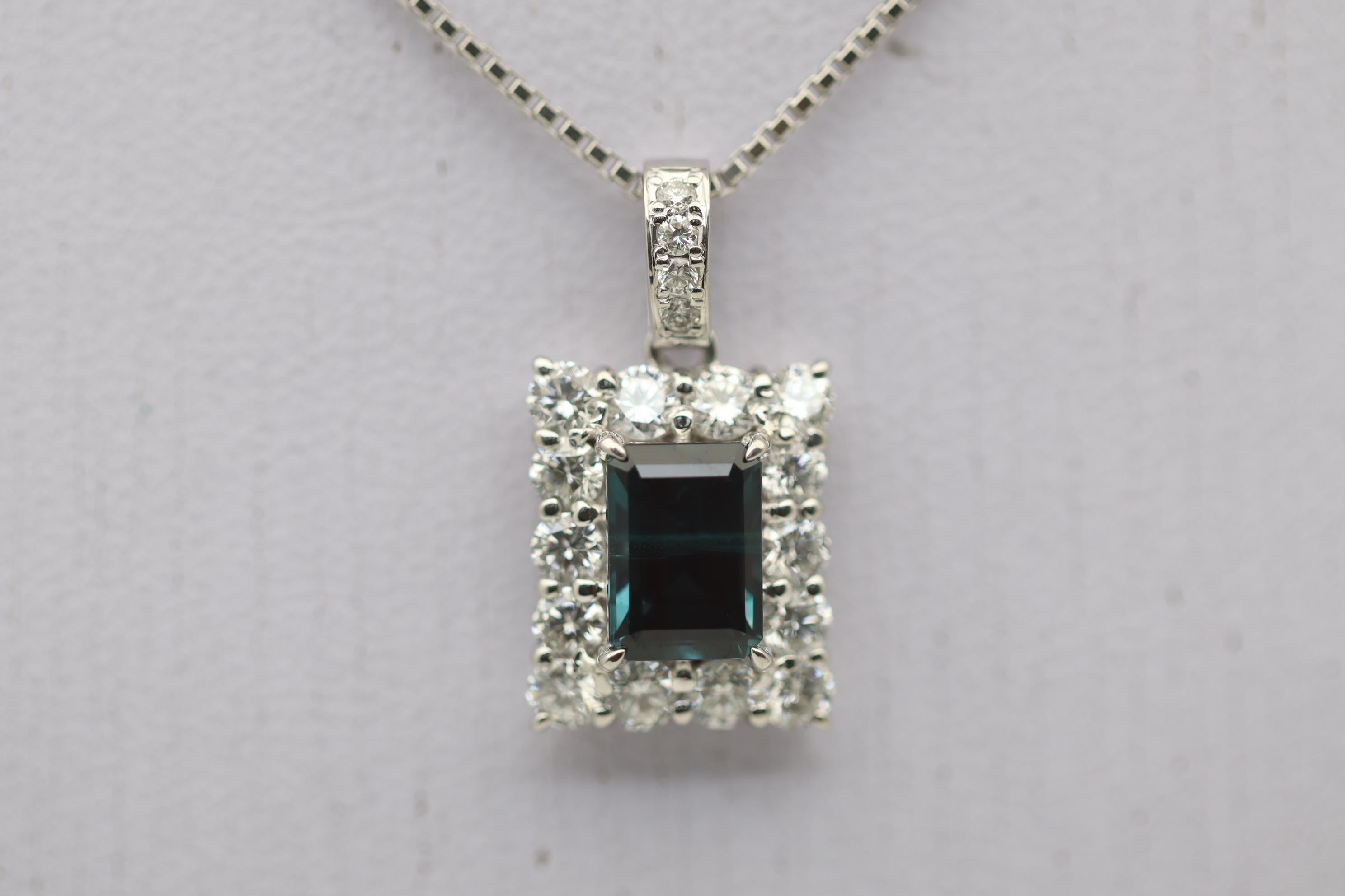 A fine and rare gem alexandrite is showcased on this picture frame diamond pendant. The alexandrite weighs an impressive 1.84 carats and has excellent color change. In normal daylight the stone is a rich blue-green color and in incandescent or