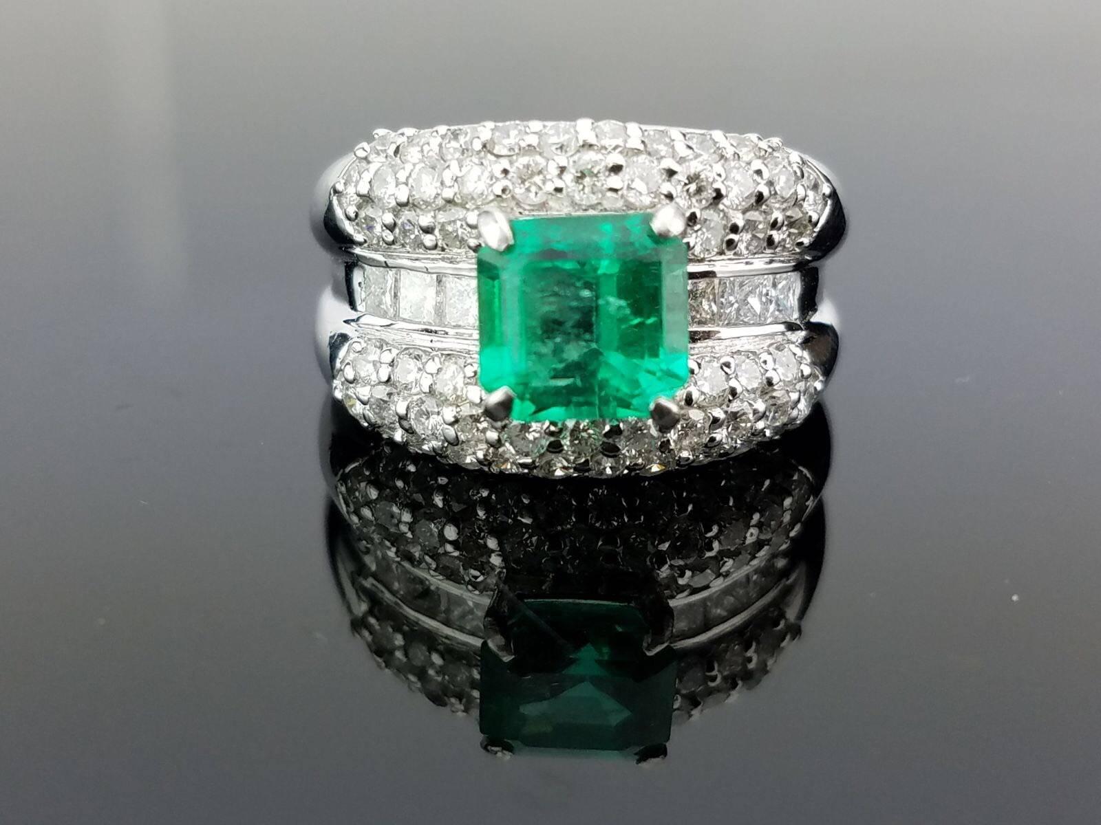 An art-deco looking 1.84 carat Colombian Emerald ring, set with white diamonds in Platinum.

Stone Details: 
Stone: Colombian Emerald
Carat Weight: 1.84 Carats

Diamond Details: 
Total Carat Weight: 1.47 carat
Quality: VS , H/I

Currently a ring