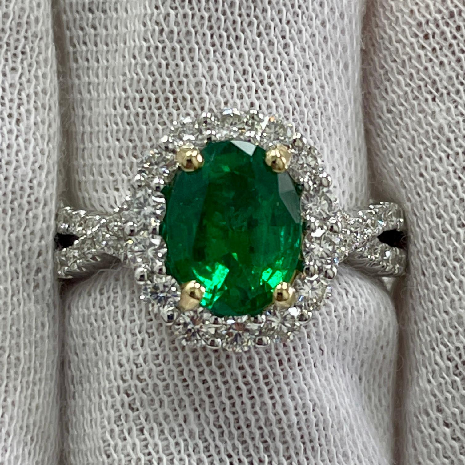 This is a LIVELY emerald with an open color, mounted in an elegant 18K white gold [with a yellow gold basket] and diamond ring with 0.85Ct of brilliant white diamonds. Suitable for any occasion!