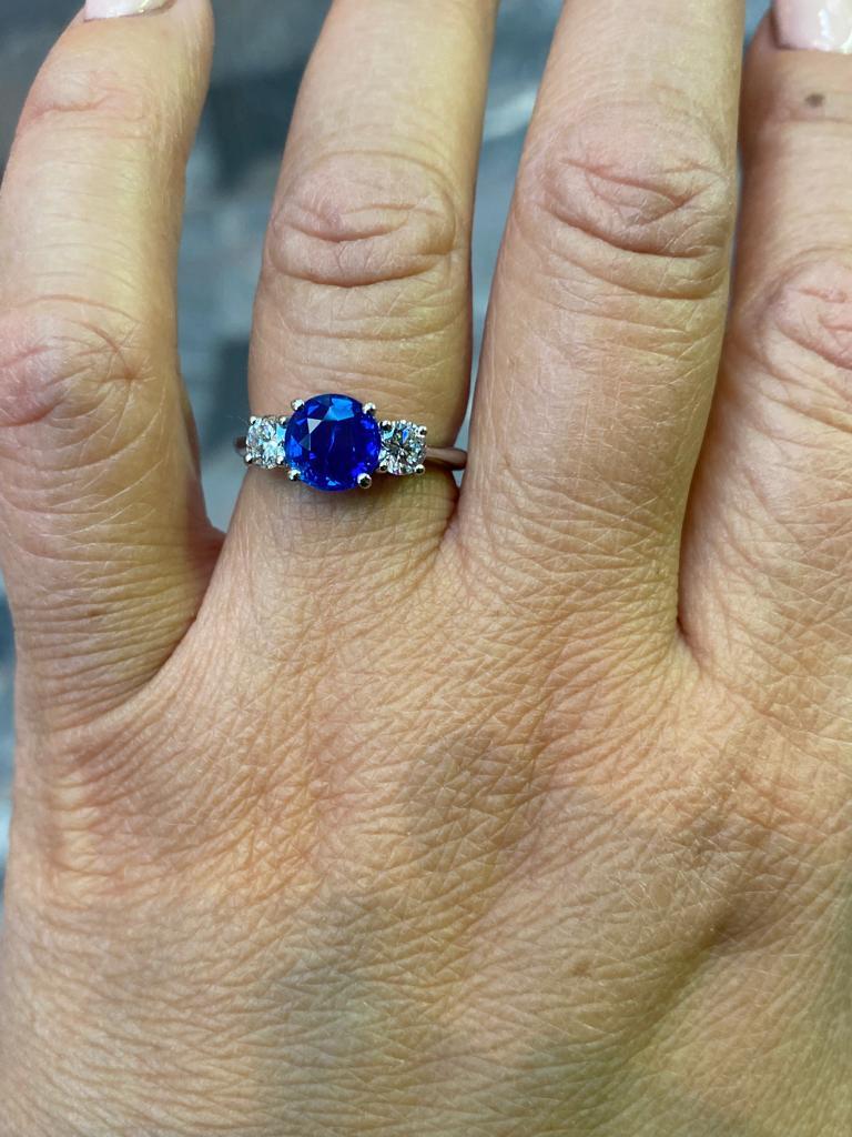 Modern 1.84 Carat Kashmir Sapphire and Diamond Three Stone Platinum Engagement Ring For Sale