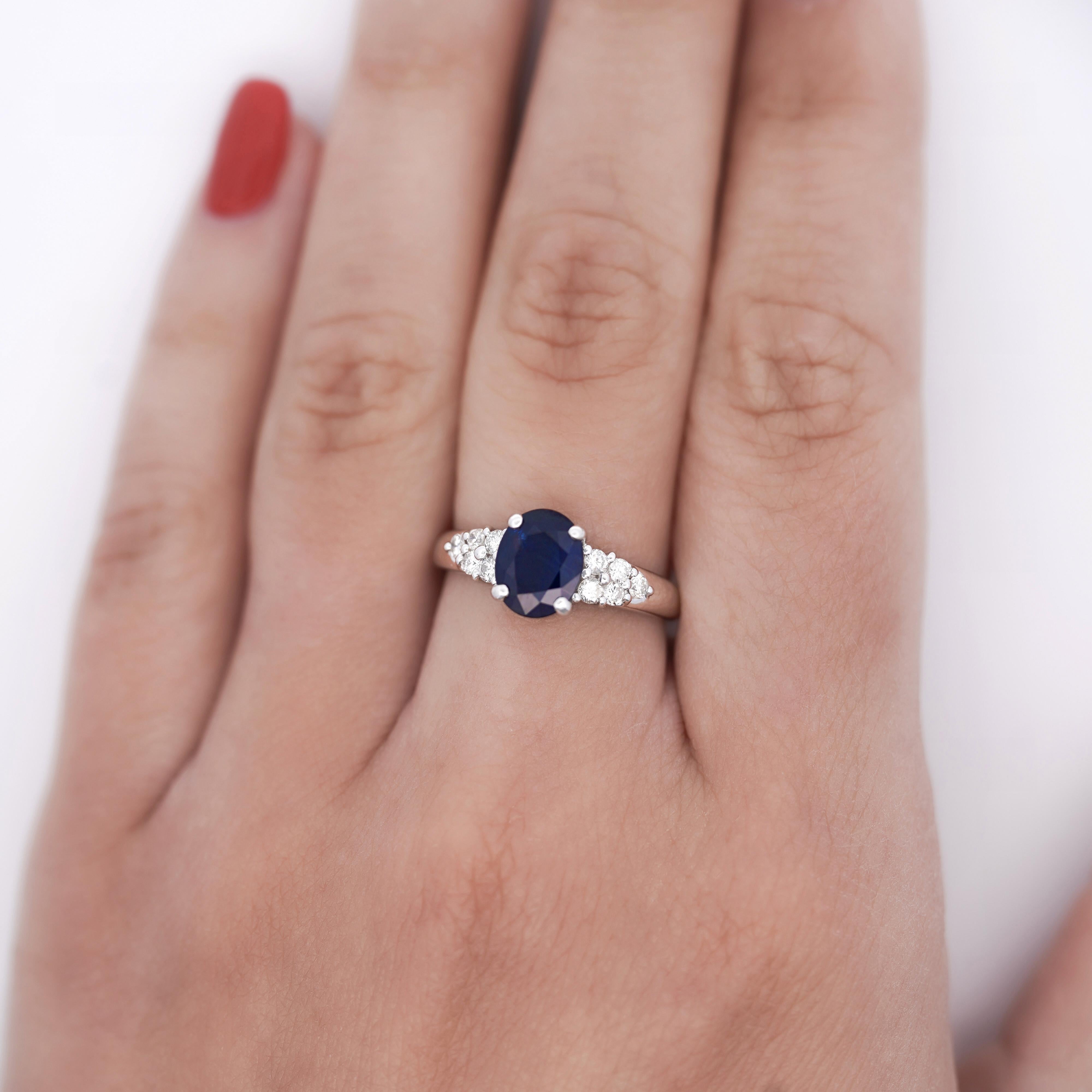 Modern 1.84 Carat Oval Cut Dark Blue Sapphire and Diamond Ring For Sale