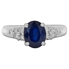 1.84 Carat Oval Cut Dark Blue Sapphire and Diamond Ring