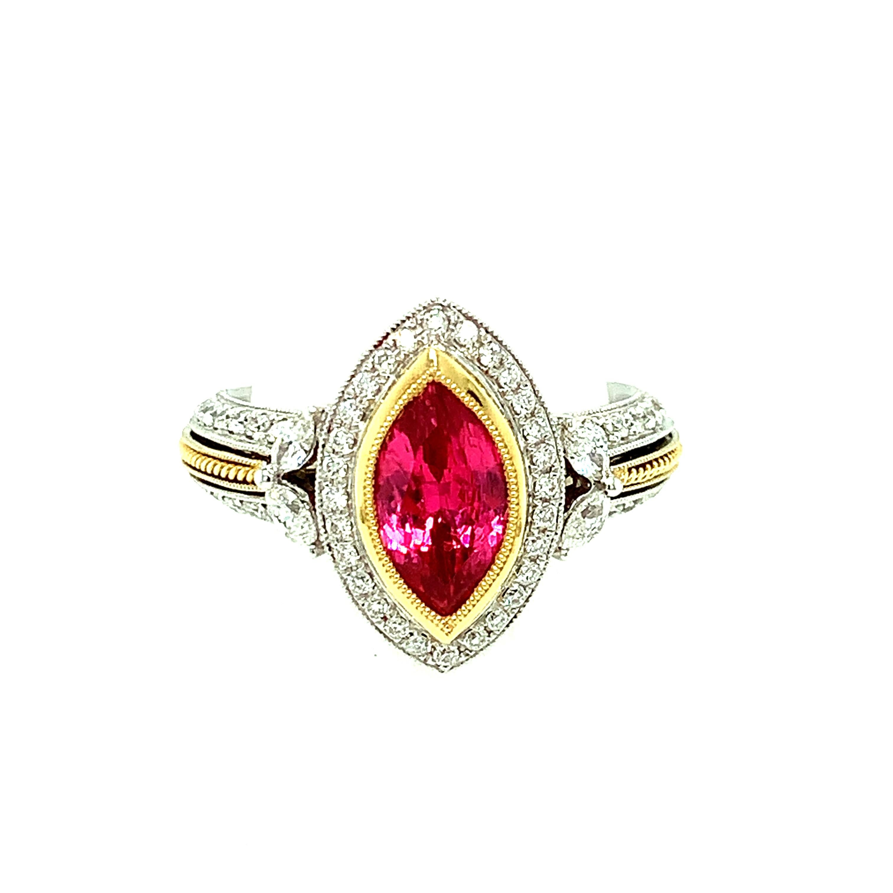 This intricately designed, two-toned cocktail ring features an unusual center stone - a marquise shaped, gem-quality hot fuchsia pink spinel! Marquise shaped spinels are a rare find, as the rough crystals generally do not lend themselves to