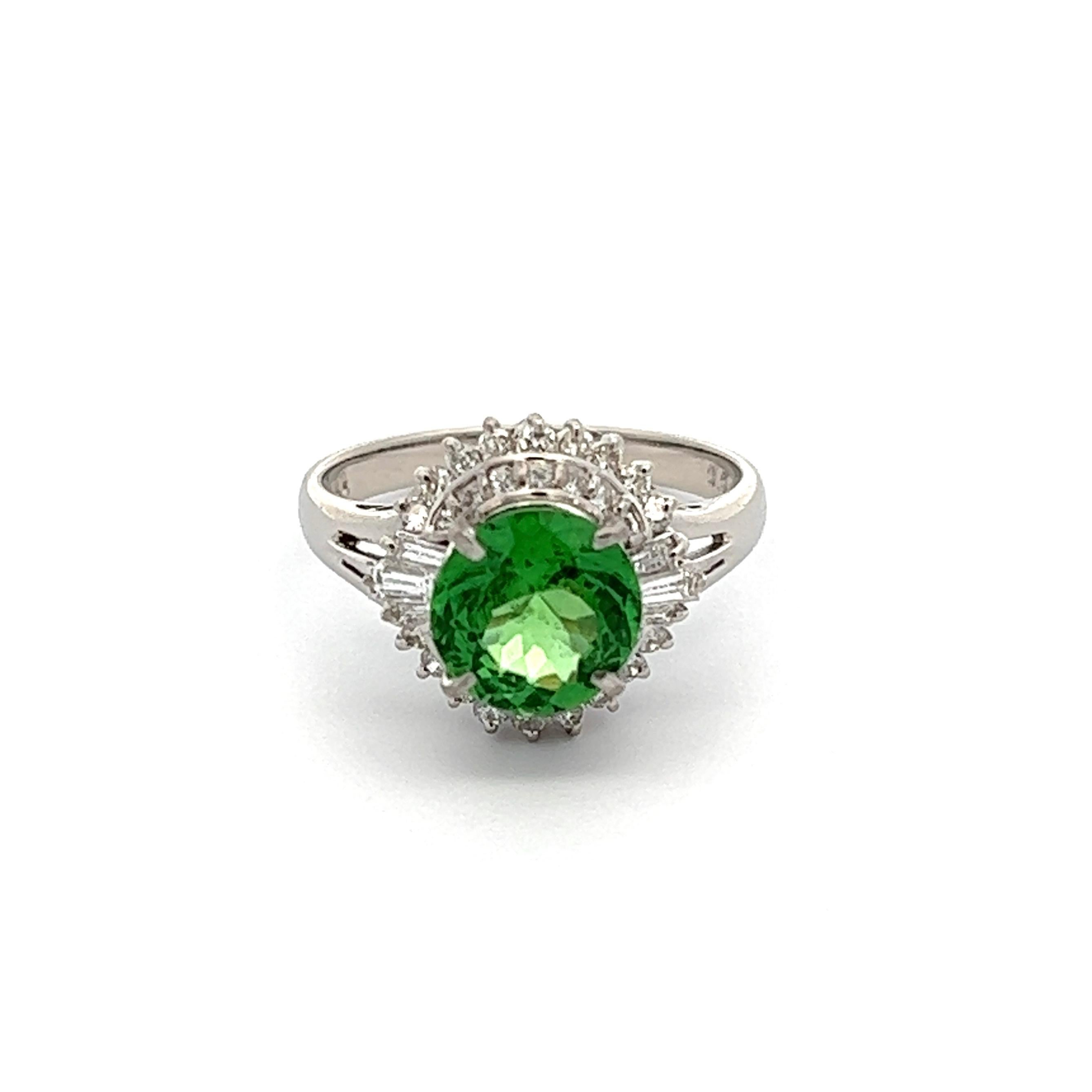 Simply Beautiful! Finely detailed Tsavorite Garnet and Diamond Cocktail Ring. Centering a securely nestled Hand set 1.84 Carat Tsavorite Garnet surrounded by Diamonds, weighing approx. 0.5tcw. Hand crafted Platinum mounting. Approx. dimensions: