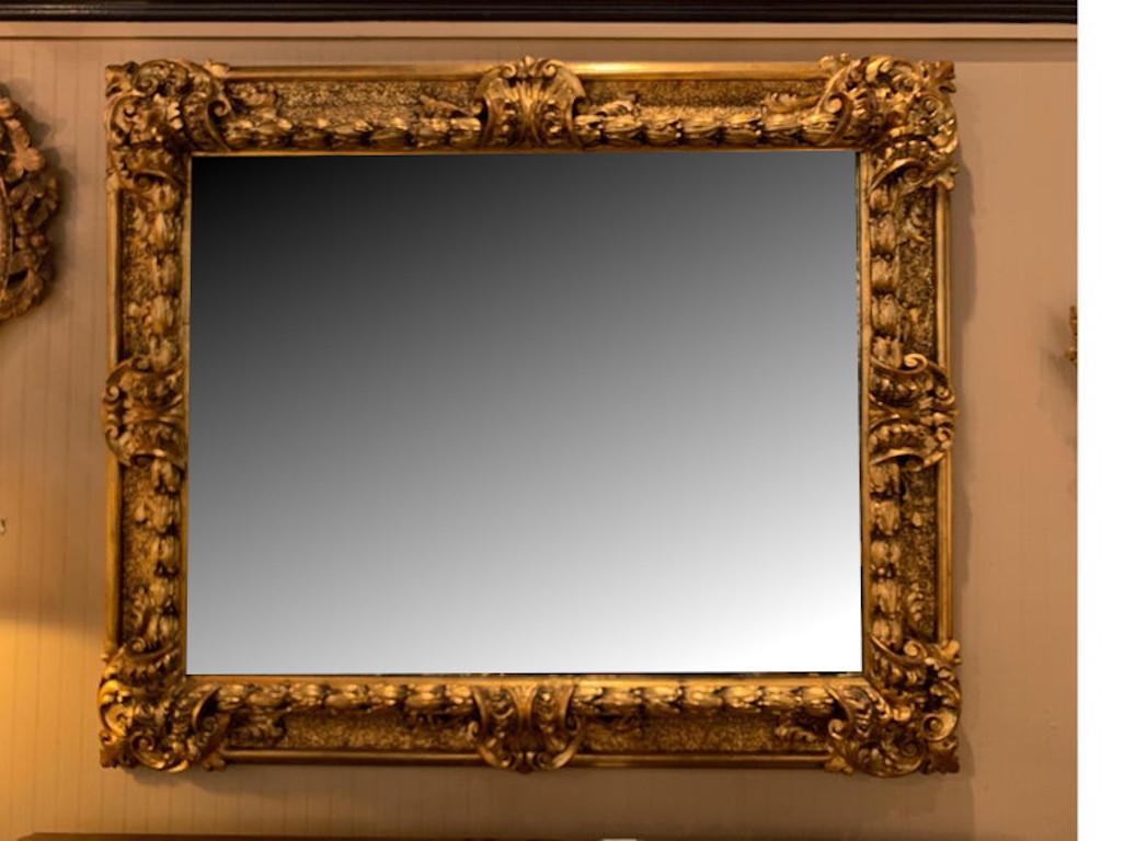 1840-1850 monumental antique ornate hand carved gold gilt and gesso mirror in a Baroque style
An absolutely stunning high quality very large antique mirror with original wood back
Dimensions: 55
