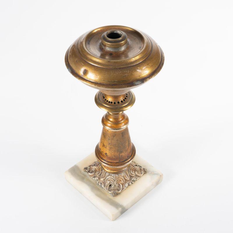 Patterned gilt lacquered brass columnar astral lamp with pear shaped font mounted on a square Vermont white marble base.
American, circa 1840.