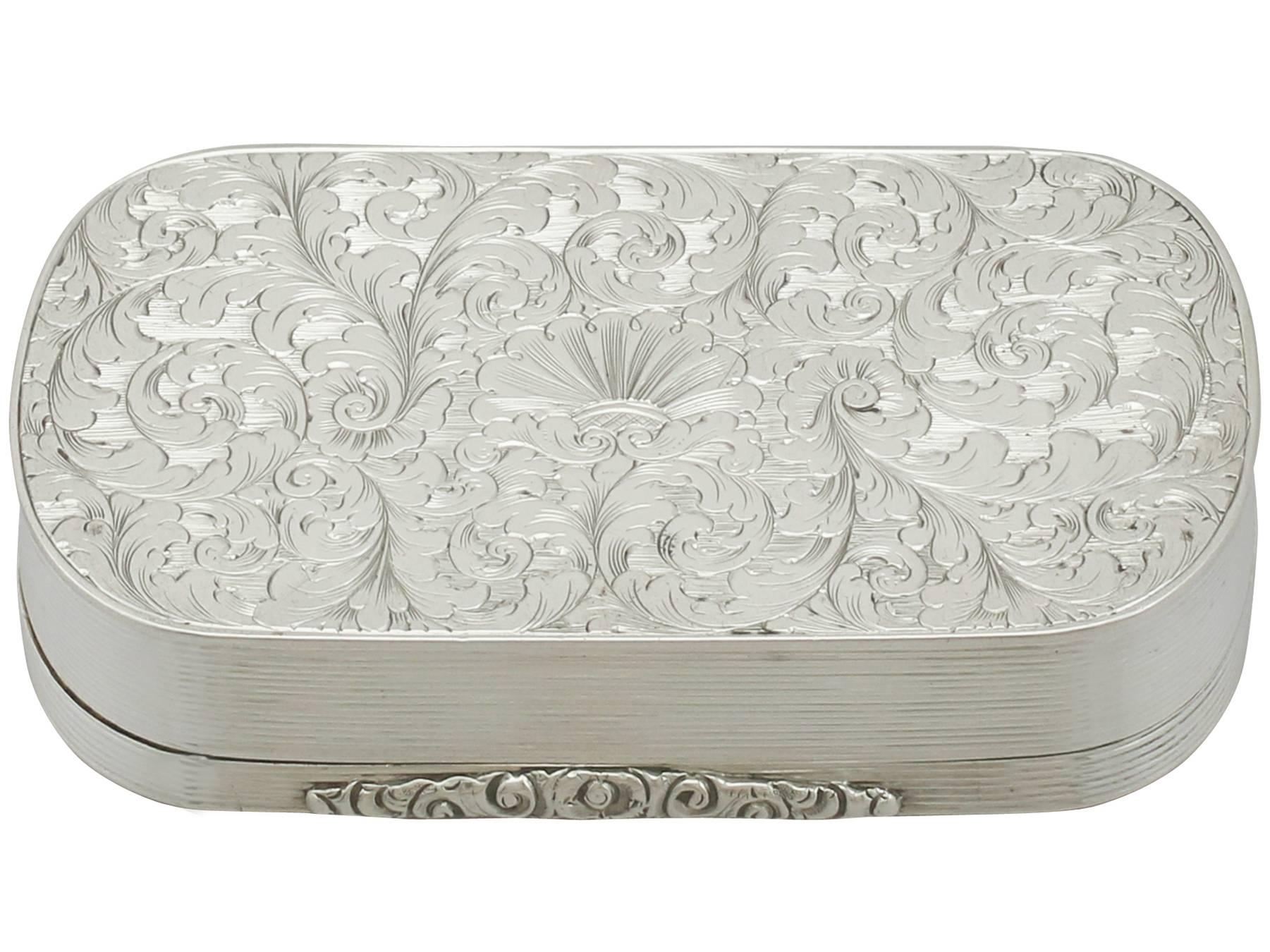 An exceptional, fine and impressive antique Victorian English sterling silver table snuff box; an addition to our collectable silverware collection.

This exceptional antique Victorian sterling silver snuff box has a rectangular form with rounded
