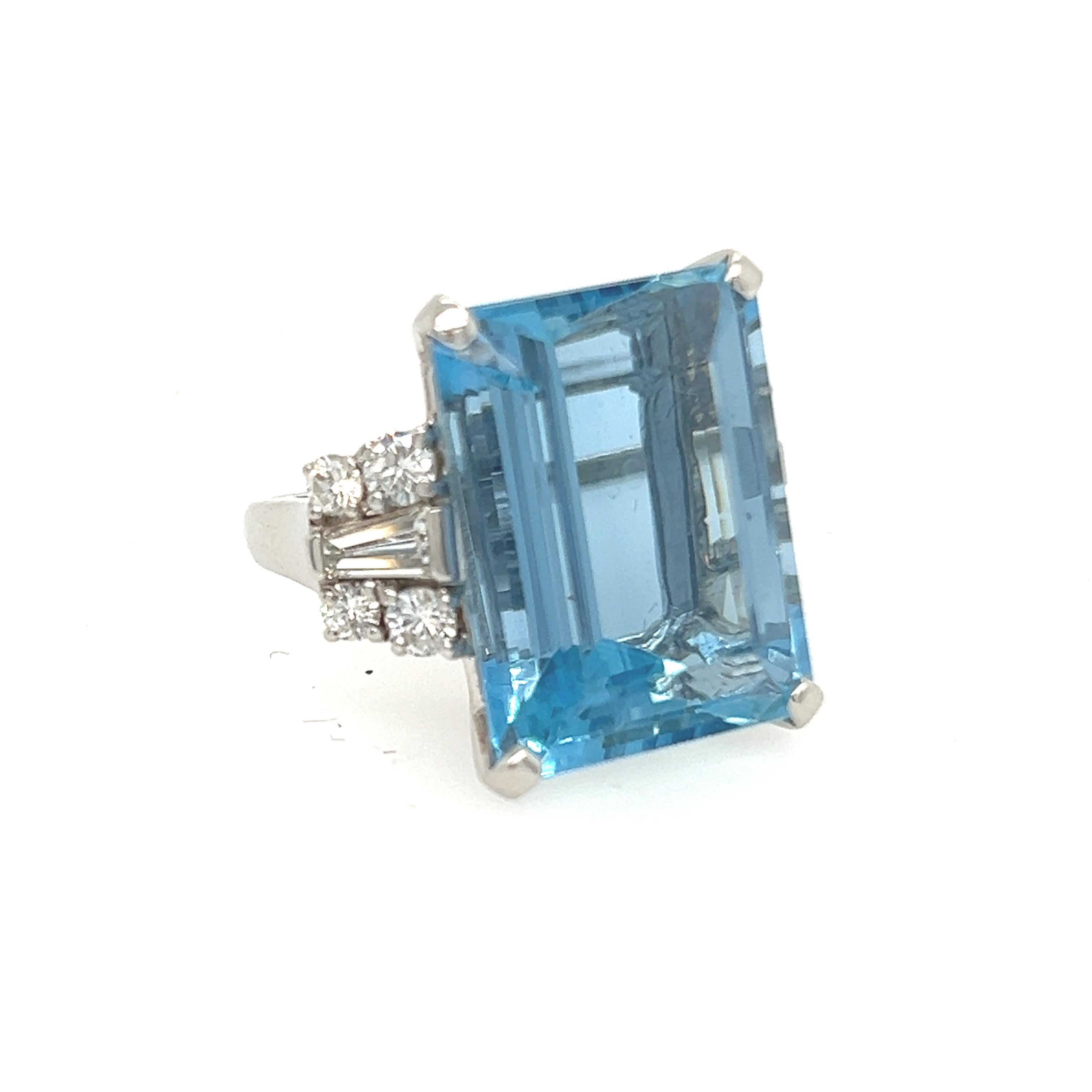 Exquisite Circa. 1940 Art Deco  Aquamarine and Diamond Ring: A Timeless Masterpiece. Transport yourself into a realm of unrivaled beauty with our Aquamarine and Diamond Ring, crafted around 1940. Nestled at its core is a breathtaking 18.40ct