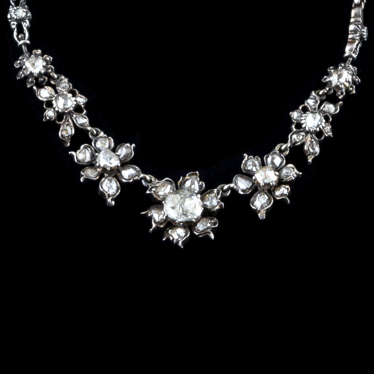 1840s sophisticated 925 °/°° silver and 18 kt white gold antique necklace with totaling 6.70 ct rose cut diamonds.
With its triangular facets arranged like the petals of a rose, this diamond was elected king of solitaires for its round shape, a