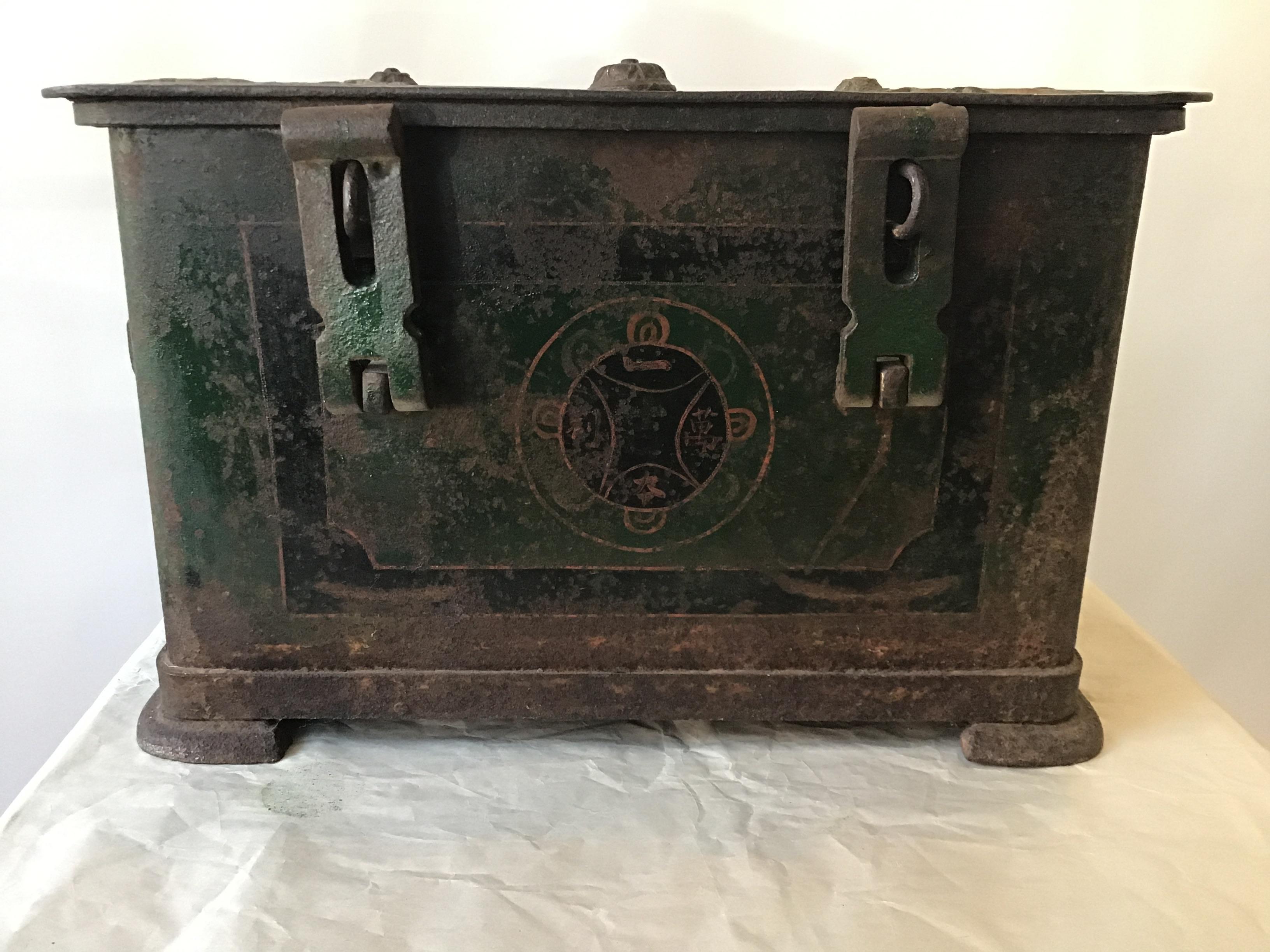 1840s Chinese safe box. The metal label in the box gives the name and address of the safe company. The painting on the front of the box means good luck. Heavy, great chunky hardware. Purchased from a Southampton, NY estate.