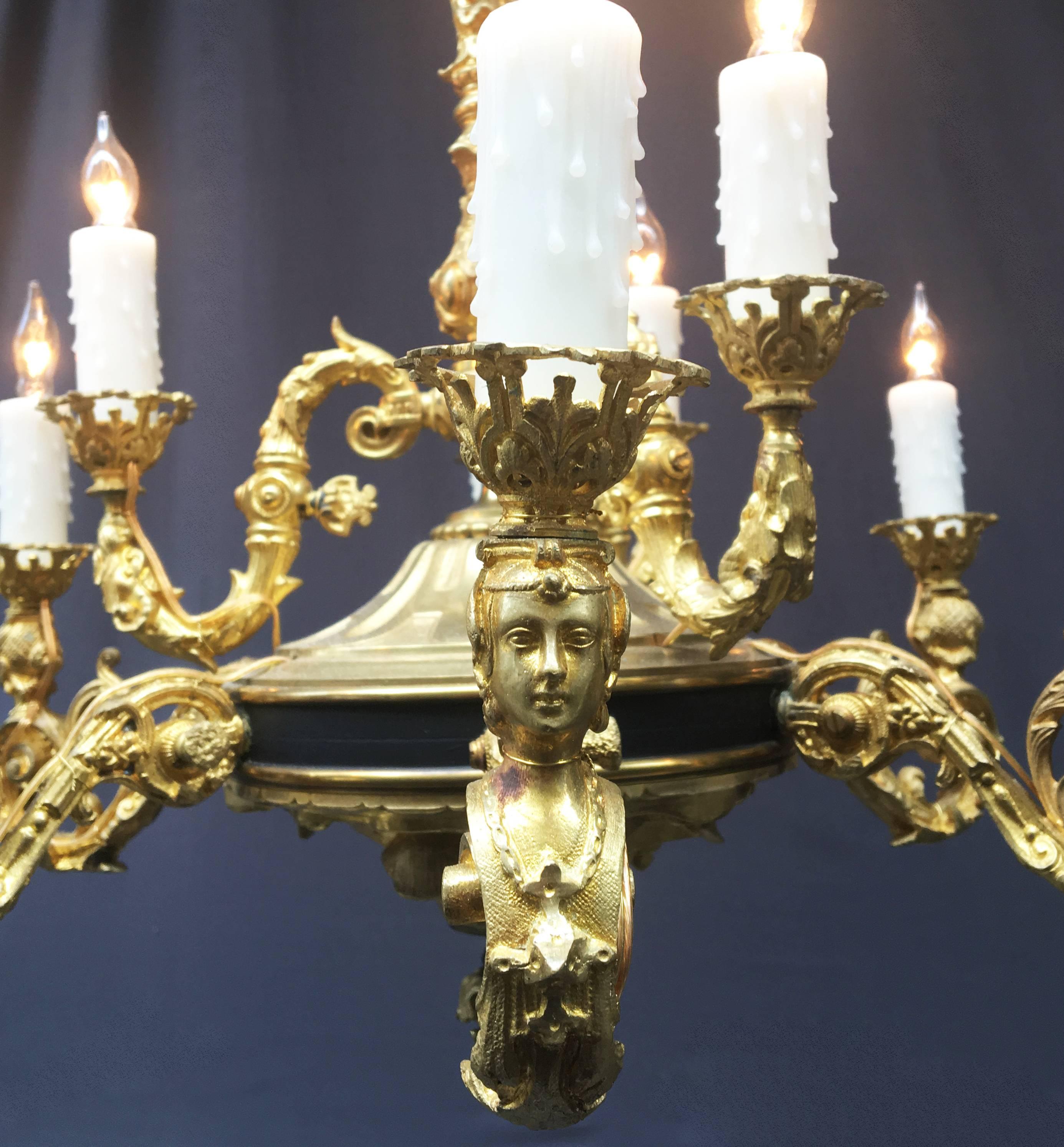 This mid-19th century French gasolier has exquisite detail. Each arm has a single gas valve. Chandelier is doré bronze and patinated.

Chandelier has been rewired and electrified. Chain and canopy is included with purchase.