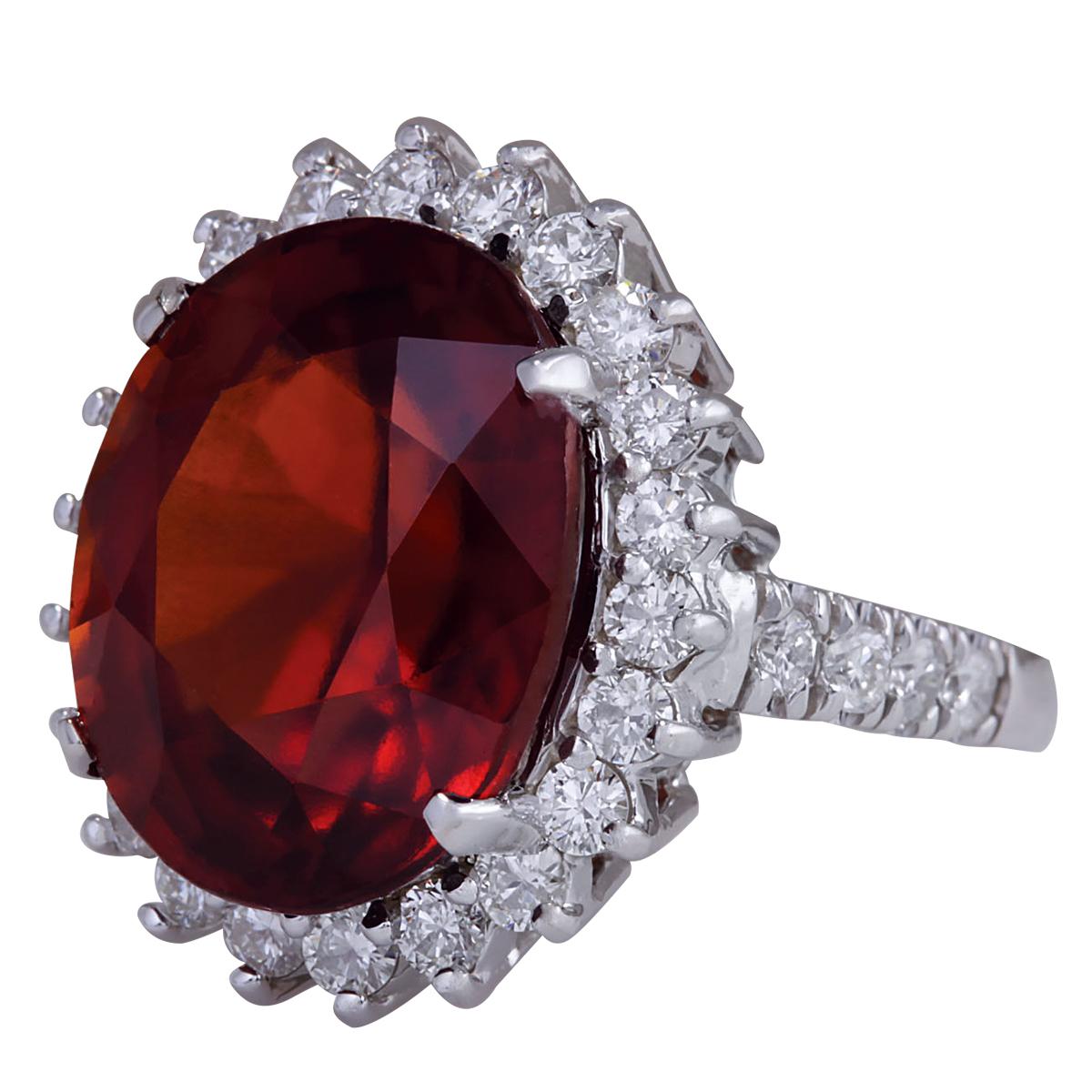 Introducing our opulent 14 Karat White Gold Diamond Ring featuring a stunning 18.43 Carat Garnet, stamped for authenticity. Crafted with meticulous care, this ring epitomizes elegance and luxury. Weighing 8.7 grams, it showcases a breathtaking