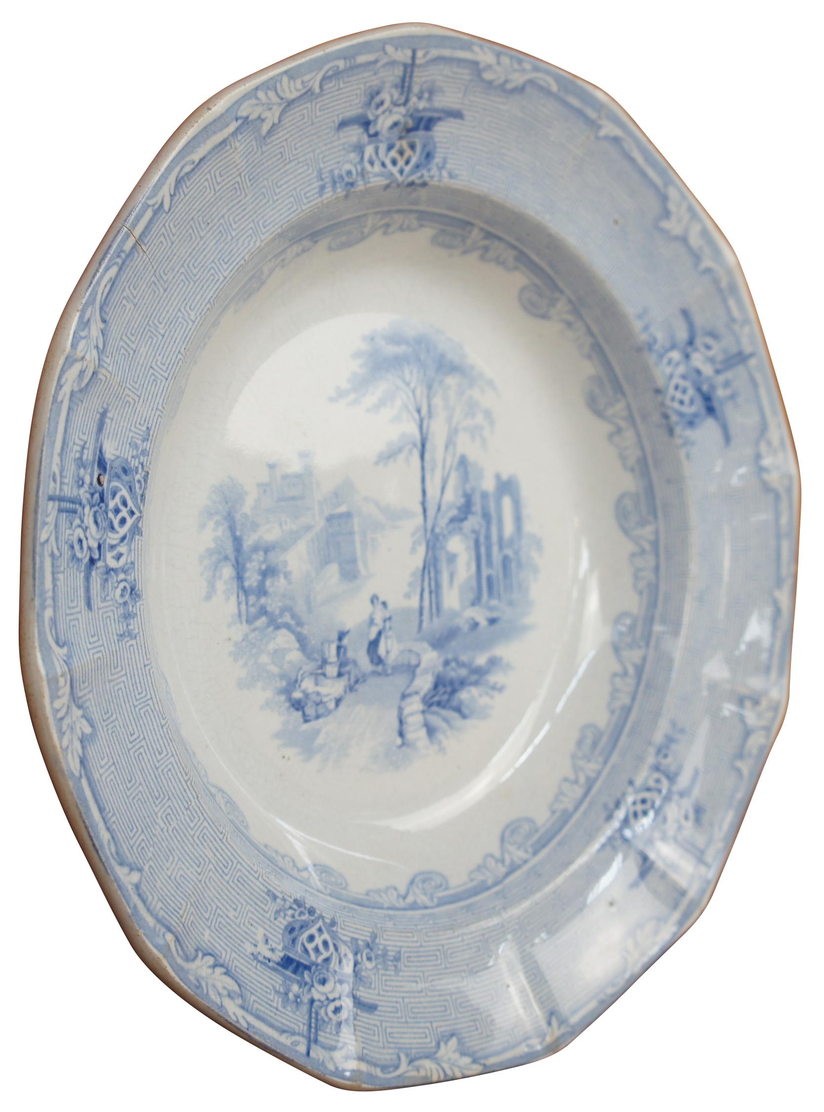 Antique 19th century J Clementson blue iron ware / transferware in the Siam pattern.  Features a cityscape scene with castle ruins and figures.  Stamped with the Phoenix / Eagle bird mark.  Registry mark dates to January 7, 1846.

Joseph Clementson