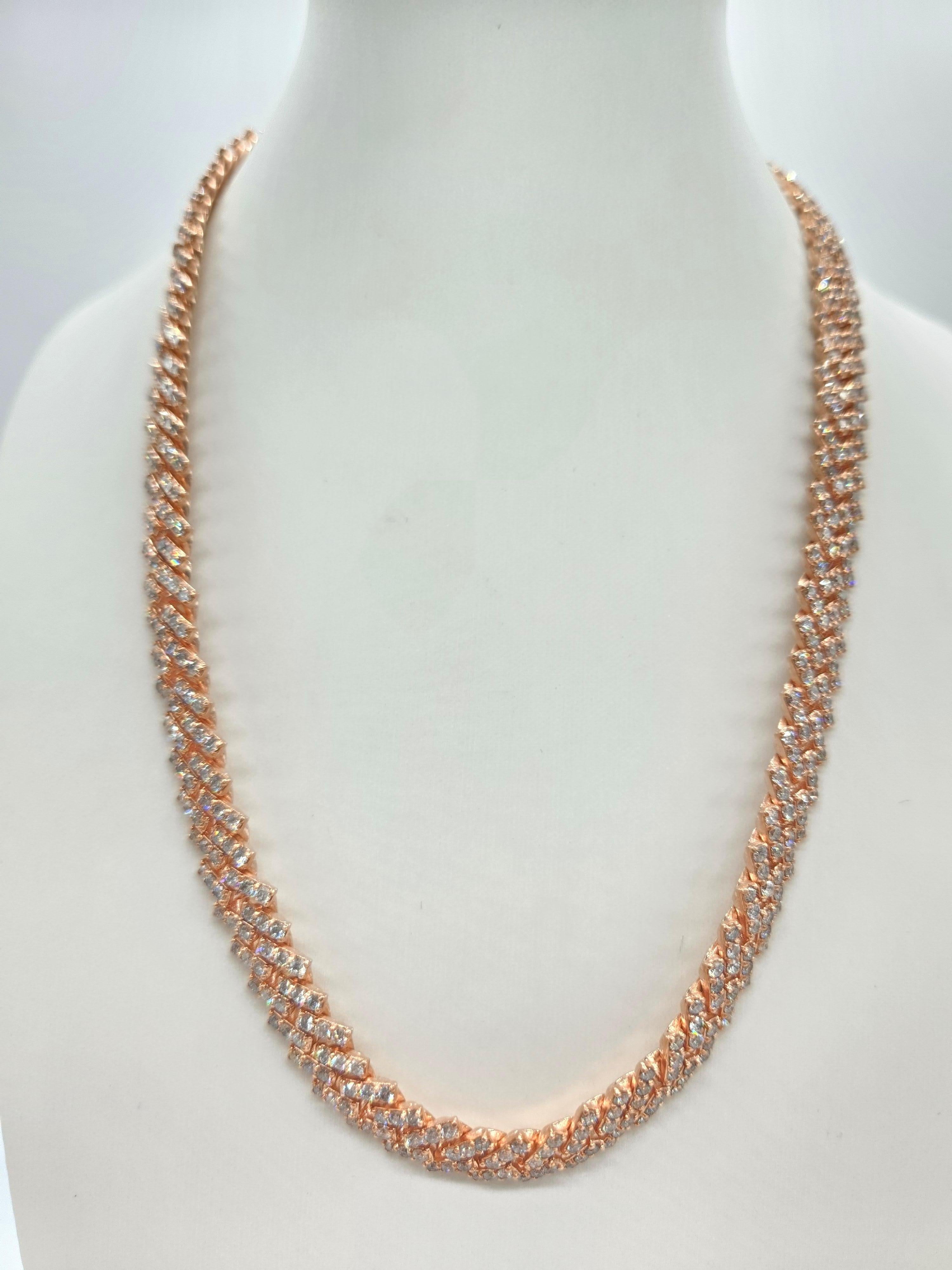 18.47 Carat Natural Diamond Cuban Necklace Chain in 10 Karat Rose Gold

Length: 18 inches

Width: 11.7 mm

Diamonds: 18.47 carats of natural diamonds

Diamond Quality: Average color H, Clarity VS-SI

Gold: 10K Rose Gold

Finish: High shine, lustrous