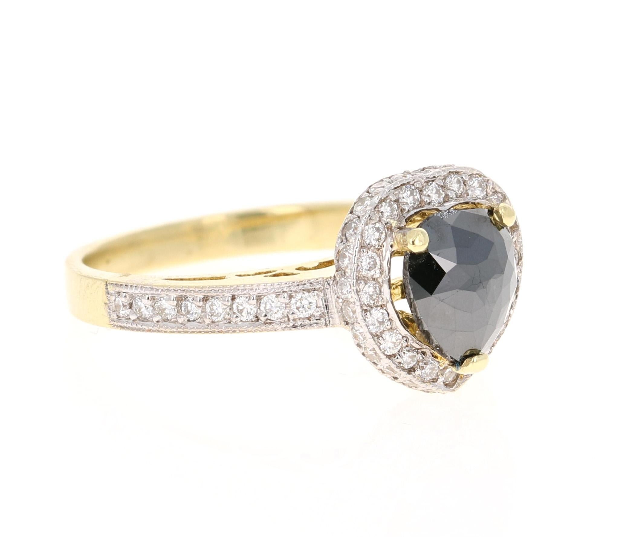 Stunning Black and White Diamond Cocktail or Engagement Ring that is a nothing but a Statement! 

The Pear/Heart Cut Black Diamond is 1.28 Carats and is surrounded by 67 Round Cut Diamonds that weigh 0.57 Carats. The total carat weight of the ring