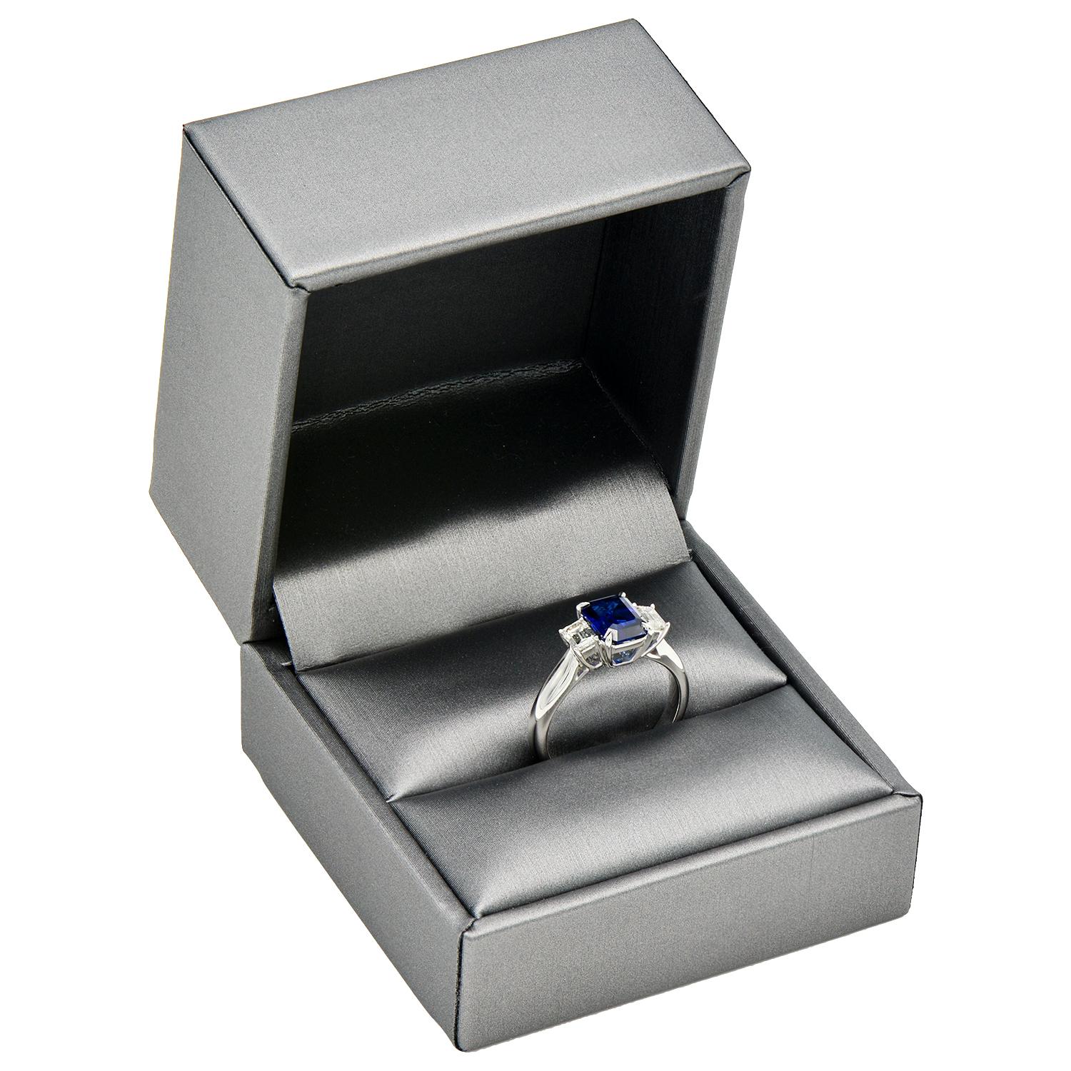 Contemporary 1.85 Carat Emerald Cut Sapphire Ring with Emerald Diamond Side Stones
