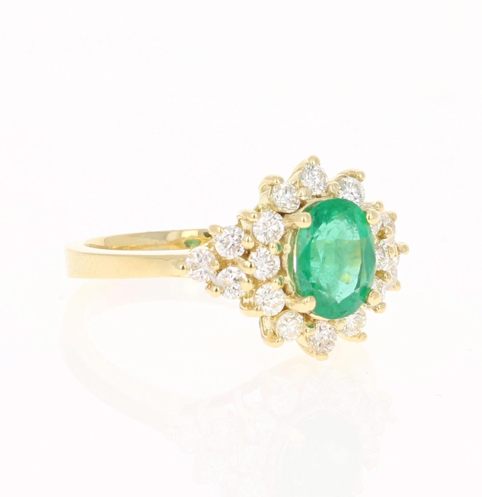 A beautiful 1.85 Carat Emerald and Diamond Ring in 18K Yellow Gold.
This gorgeous ring has a 1.15 Carat Oval Cut Emerald that is set in the center of the ring!  The Emerald is surrounded by 18 Round Cut Diamonds that weigh 0.70 cts. The Clarity is a