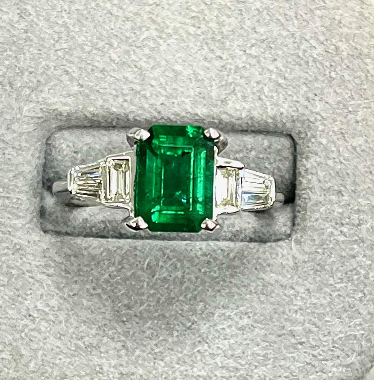 1.85 Carat Zambian oval shape emerald set in 18k whie gold ring with  diamonds 