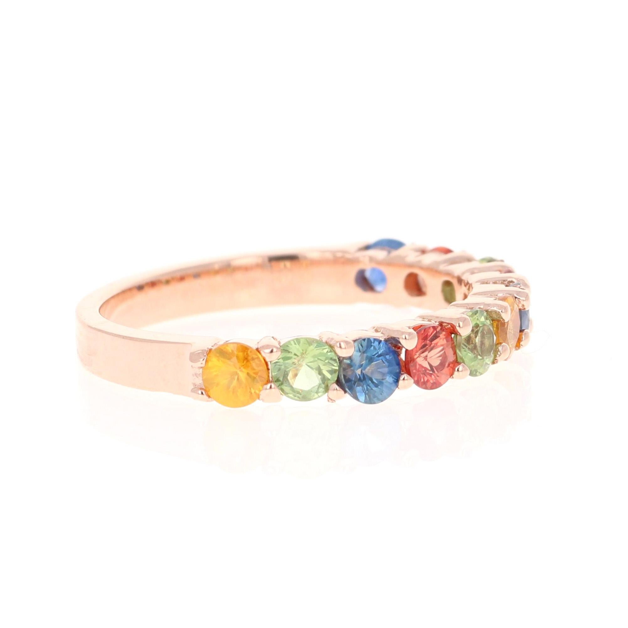 There are 11 Multicolored Genuine Sapphires in this band that weigh 1.85 Carats.  
It is perfect for everyday wear and looks amazing stacked or alone.  They are versatile and can jazz up to any outfit and occasion!  
This band is created in 14 Karat