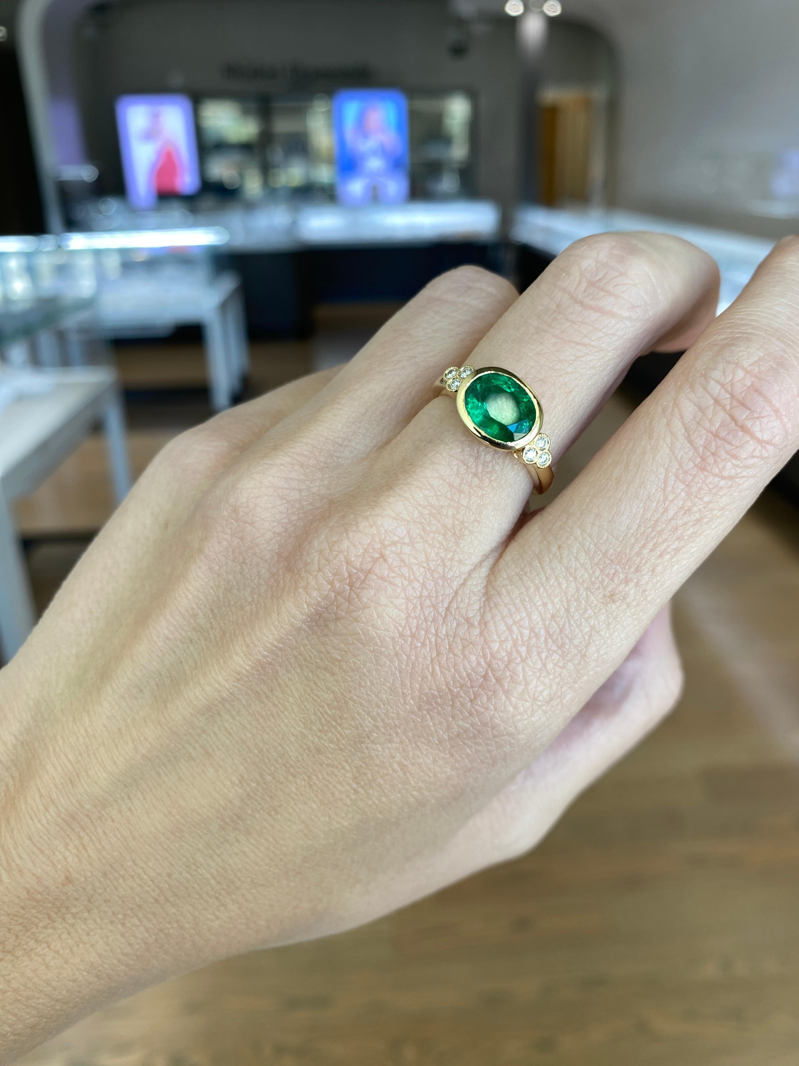 1.85 Carat Natural Oval Cut Bezel Set Emerald 14 Karat Yellow Gold Ring For Sale 12