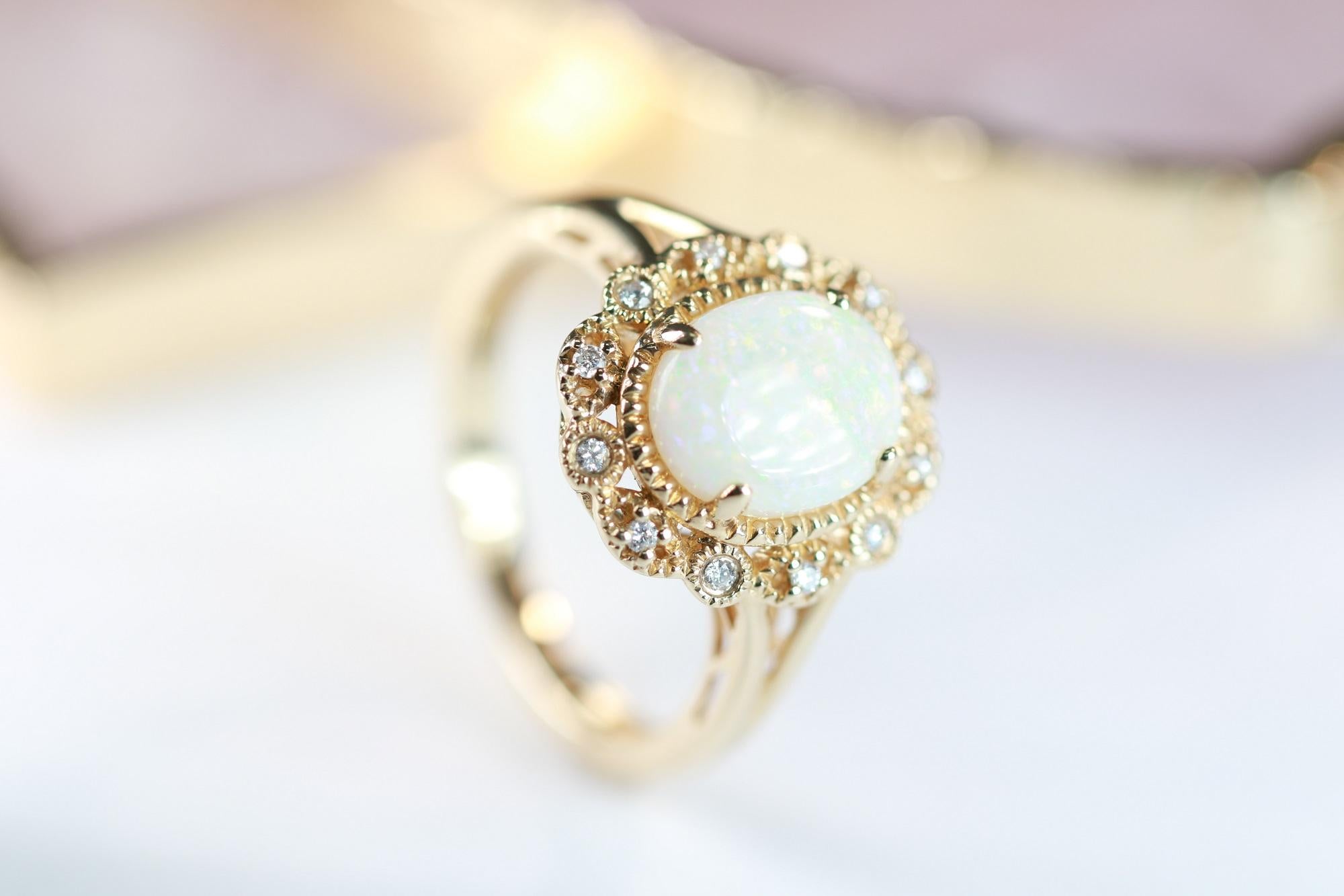 Oval Cut 1.85 Carat Oval Cab Ethiopian Opal and Round Diamond 10 Karat Yellow Gold Ring For Sale