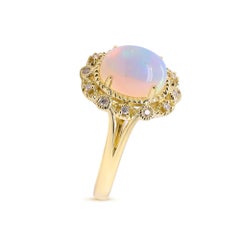 1.85 Carat Oval Cab Ethiopian Opal and Round Diamond 10 Karat Yellow Gold Ring
