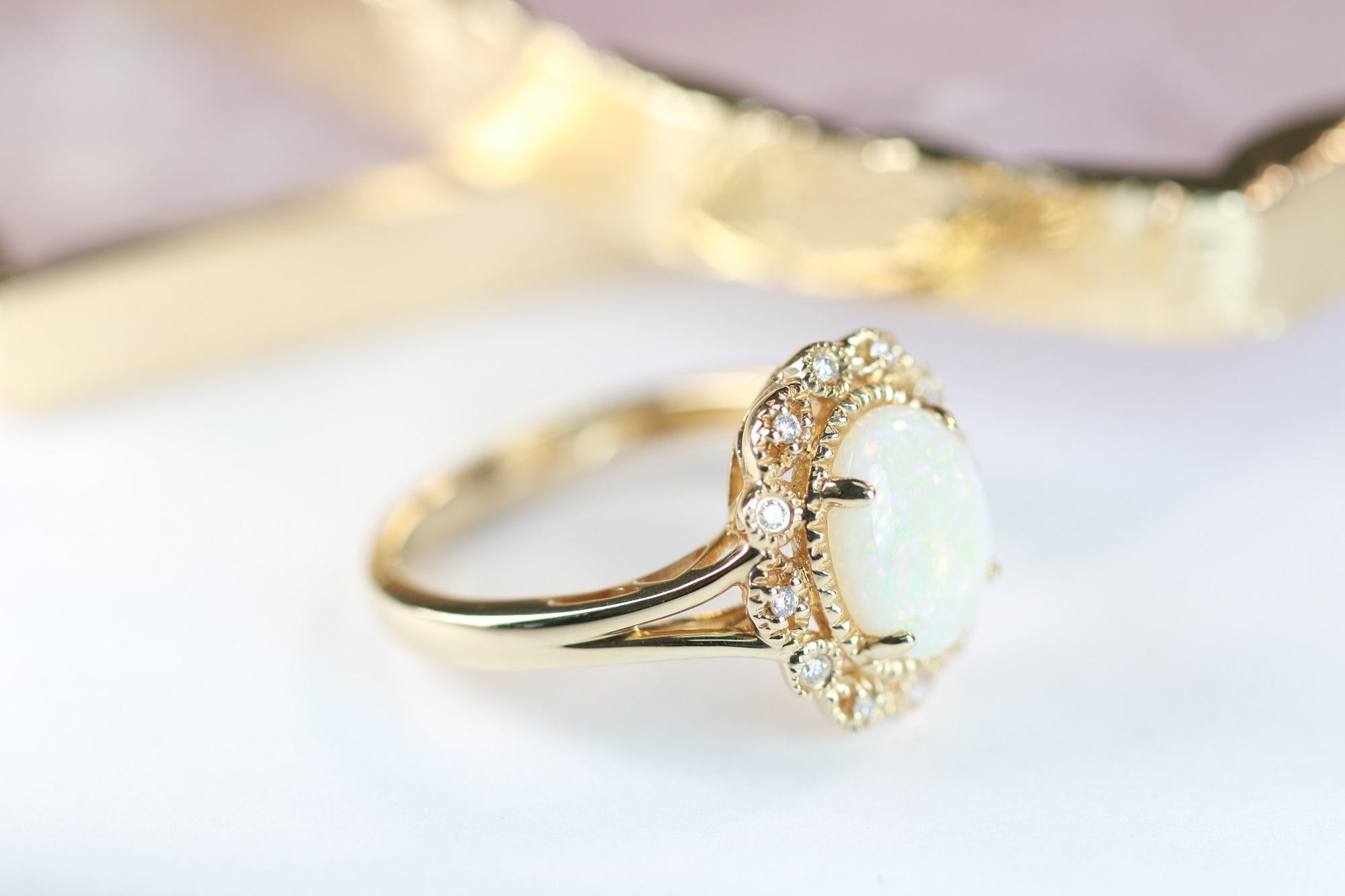 1.85 Carat Oval Cab Ethiopian Opal and Round Diamond 10 Karat Yellow Gold Ring In New Condition For Sale In New York, NY