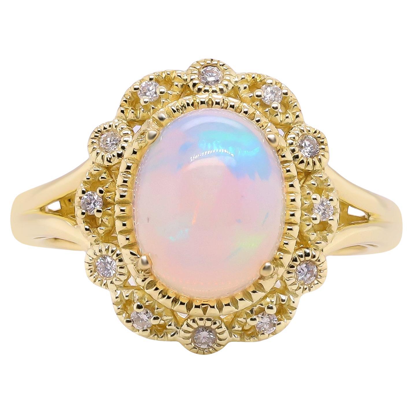 1.85 Carat Oval Cab Ethiopian Opal and Round Diamond 10 Karat Yellow Gold Ring For Sale