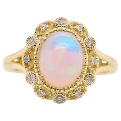 1.85 Carat Oval Cab Ethiopian Opal and Round Diamond 10 Karat Yellow Gold Ring