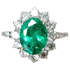 1.85 Carat Oval cut Emerald Ring with Round Diamonds in 18K White Gold