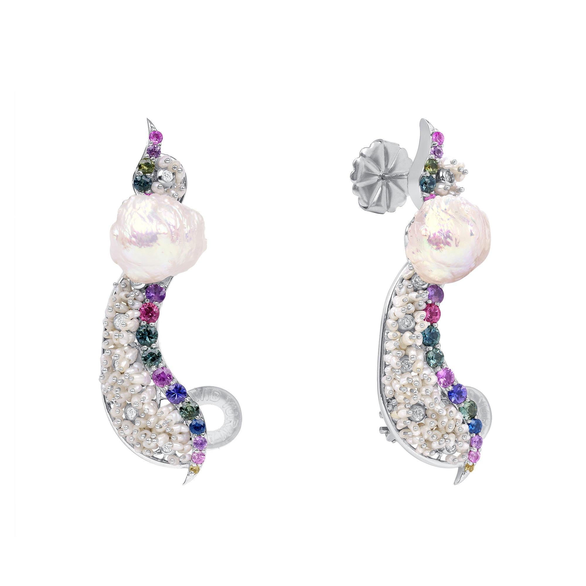 These dissimilar ear cuffs feature 18.5 carats of cultured freshwater rosebud pearls and 2.9 carats of cultured Akoya Pearls set in platinum. They also feature 1.71 carats of multicolor AAA round sapphires, and 0.06 carats of SI-1, G-H, round