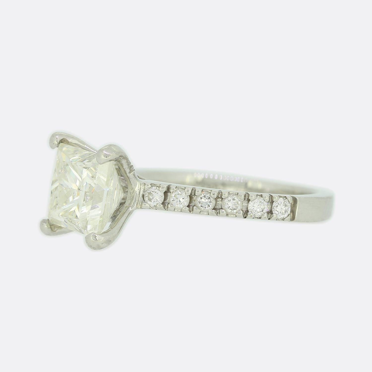 This is a classic platinum diamond engagement ring. The focal point of this ring is a 1.85 carat princess cut diamond set in a four claw mount. Each shoulder is set with a further 6 round brilliant cut diamonds

Condition: Used (Very Good)
Weight: