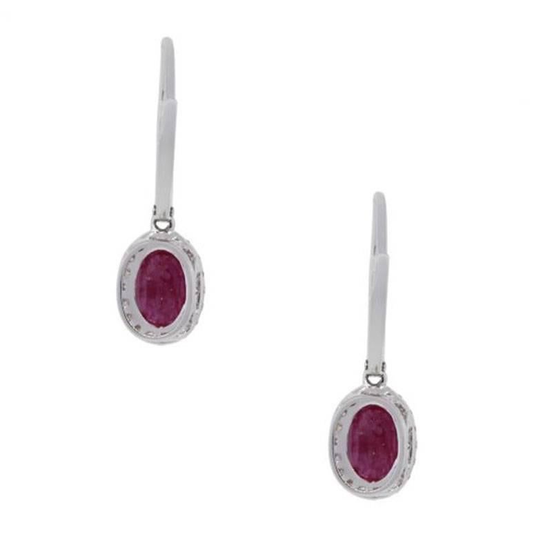 Style: Ruby and diamond dangle earrings
Material: 14k white gold
Gemstone Details: Approximately 1.85ctw ruby gemstones
Diamond Details: Approximately 0.26ctw of Round brilliant diamonds, diamonds are G/H in color and SI in clarity.
Earring