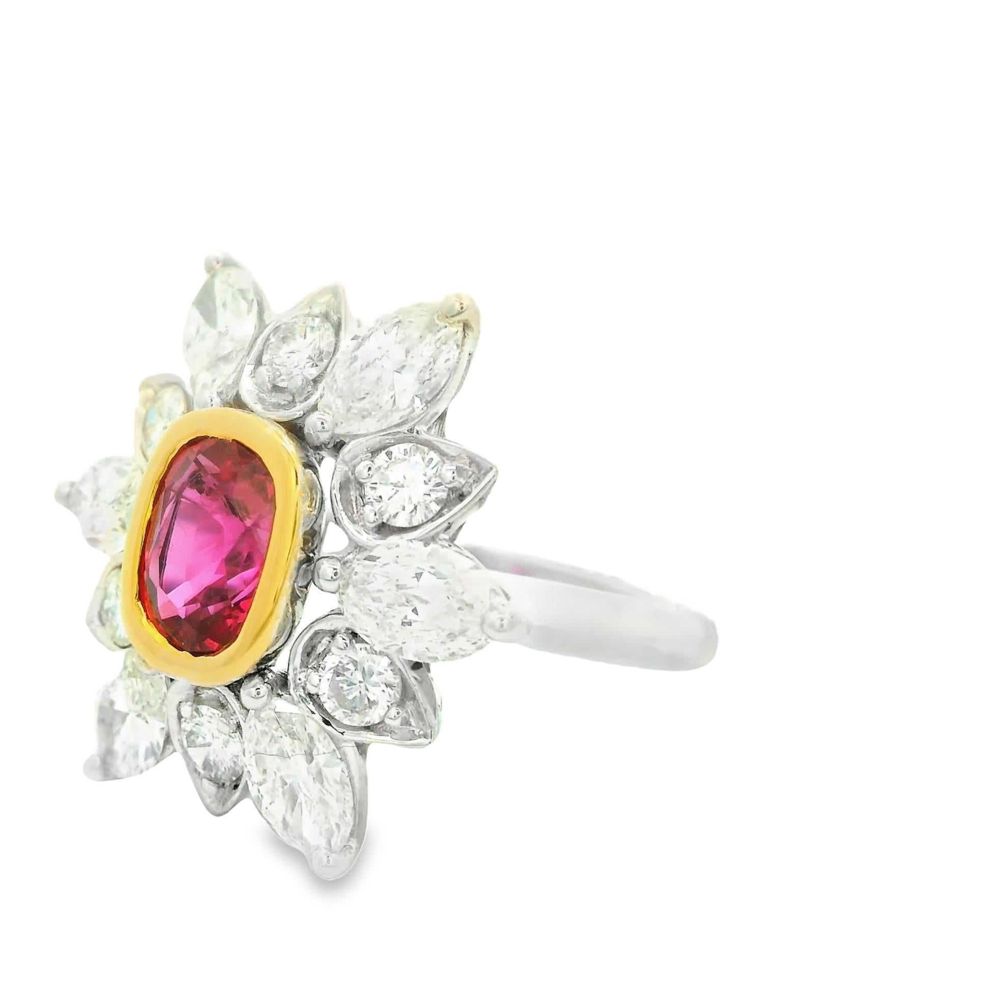 A fine and elegant ruby is set in the middle of this diamond sunburst designed ring! The ruby has a rich pure red color that glows in the light. It is certified by the AGL lab in New York as natural with a Thai origin. It is surrounded by 2.25