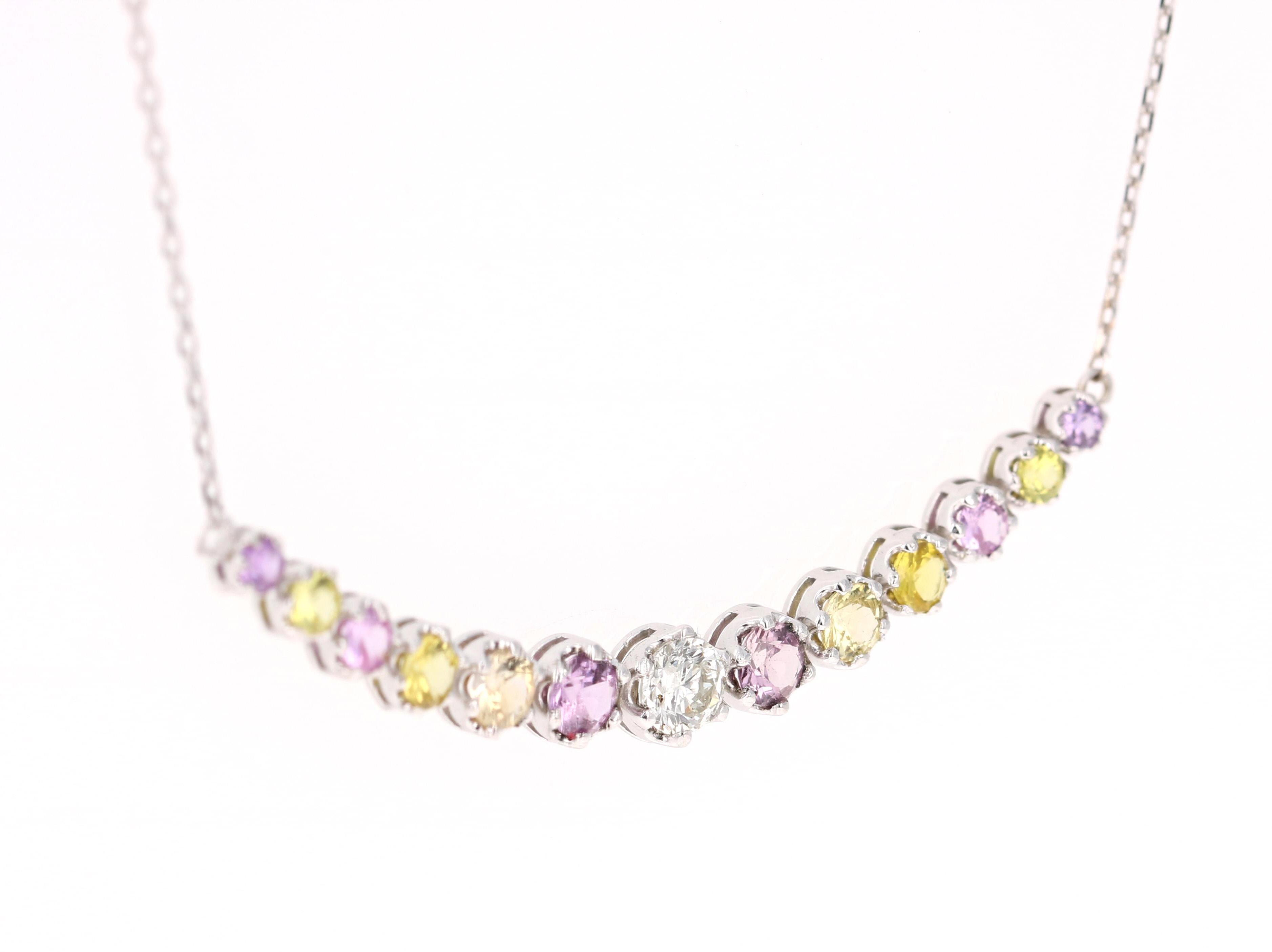 Beautiful Yellow and Pink Sapphire and Diamond Necklace that sits perfectly! 

12 Pink and Yellow Sapphires that weigh 1.54 Carats and a Round Cut Diamond that weighs 0.31 Carats. The total carat weight of the necklace is 1.85 Carats. 

It is