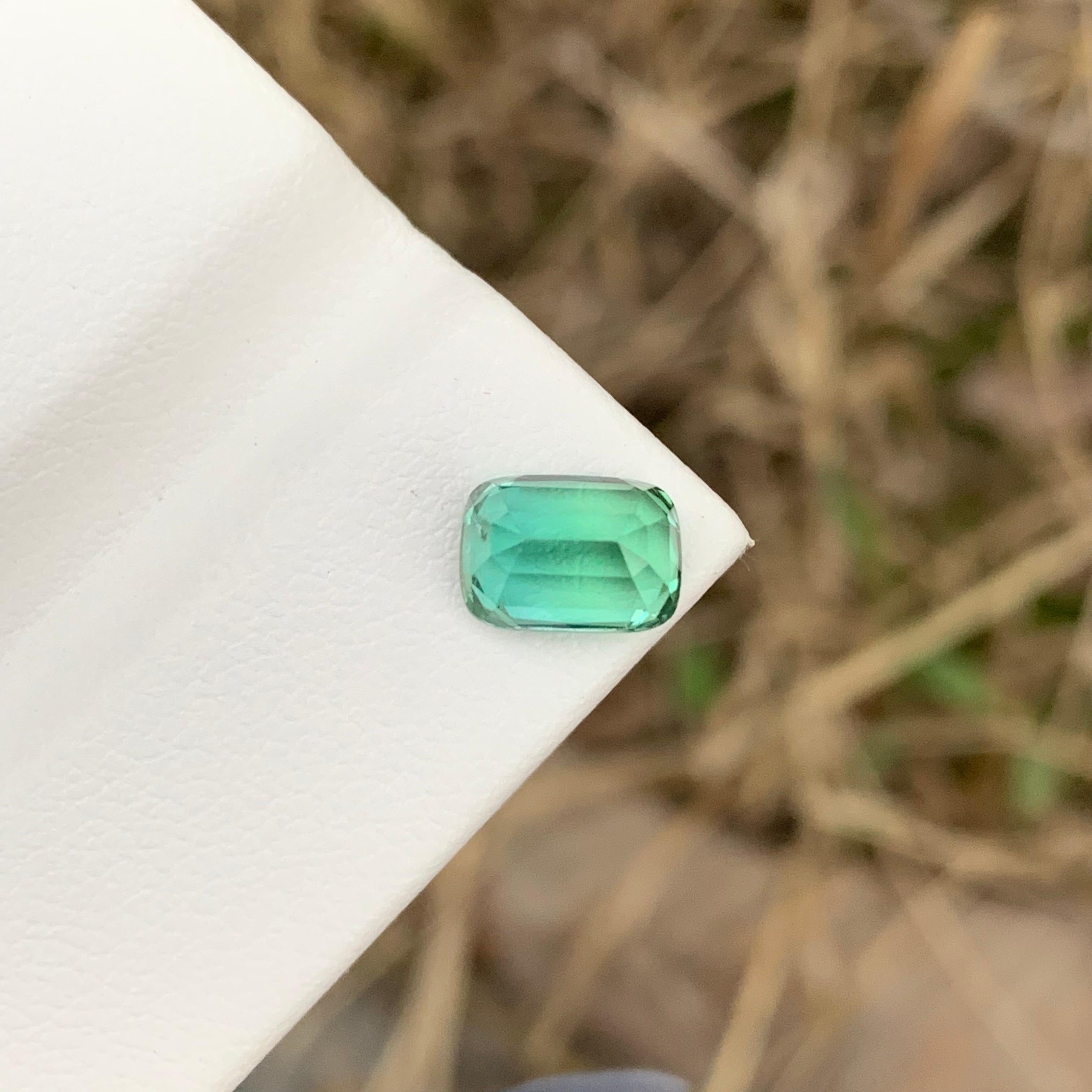 Loose Tourmaline
Weight: 1.85 Carats 
Dimension: 7.9x5.6x5.1 Mm
Origin: Kunar Afghanistan 
Shape: Long Cushion 
Color: Greenish Blue
Treatment: Non
Certificate: On Demand 
Tourmaline, a mesmerizing gemstone, comes in a spectrum of colors, making it
