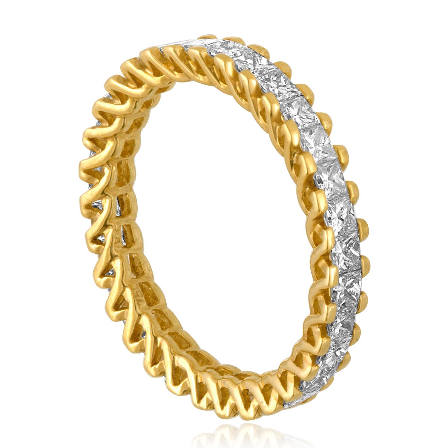 Very Unusual Gold Eternity Band
The ring is 18K Yellow Gold
There is 1.85 Carats F VS Princess Cut Diamonds
There are 31 stones in the ring.
The ring is a size 7, not sizable.
The ring weighs 2.4 grams