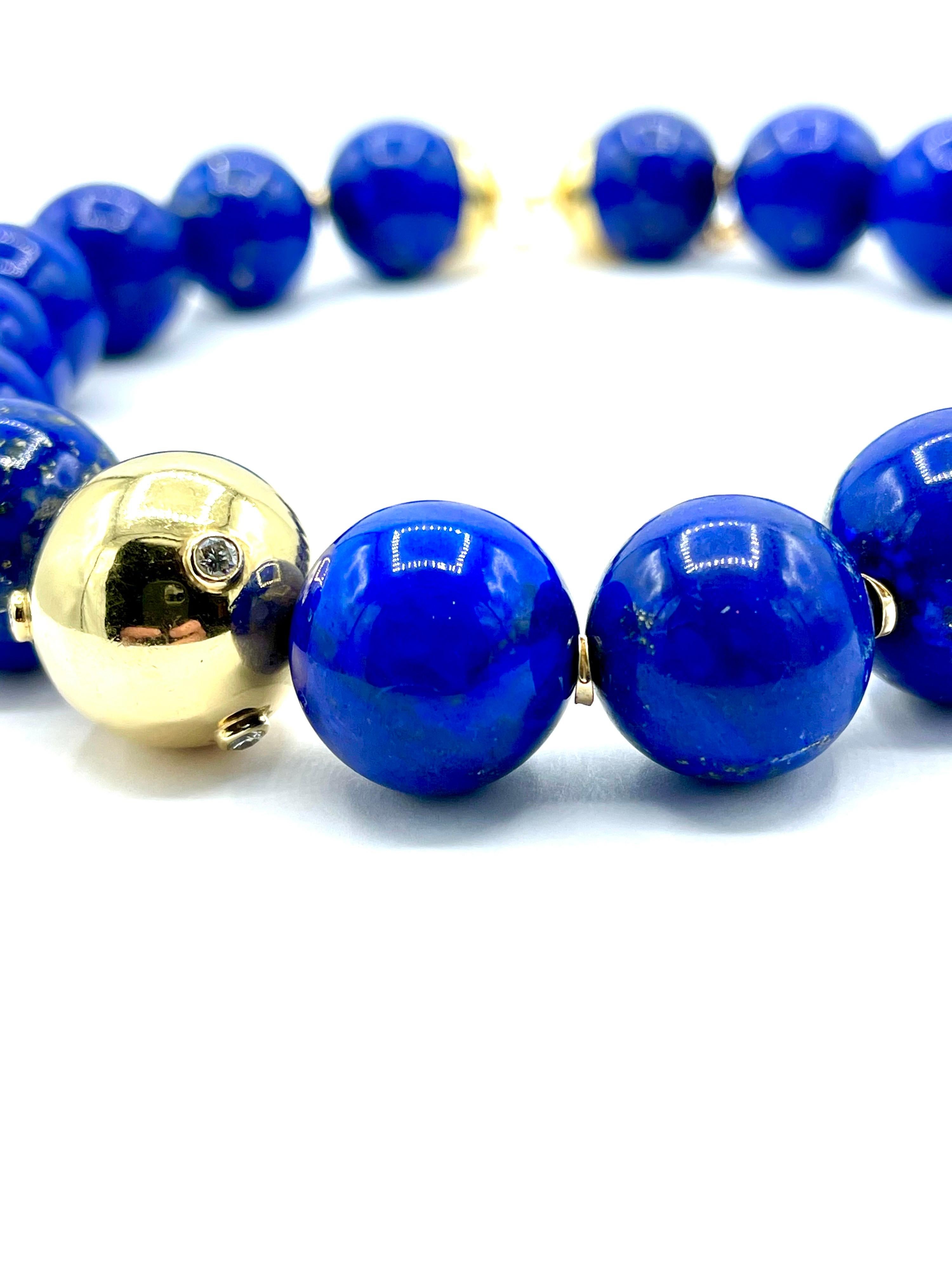 Always and iconic style bead necklace!  The beads range in size from 18.50 - 20.50mm and display a beautiful blue color with large flecks of pyrite.  There is an offset 18k yellow gold ball with bezel set round brilliant Diamonds weighing 0.60