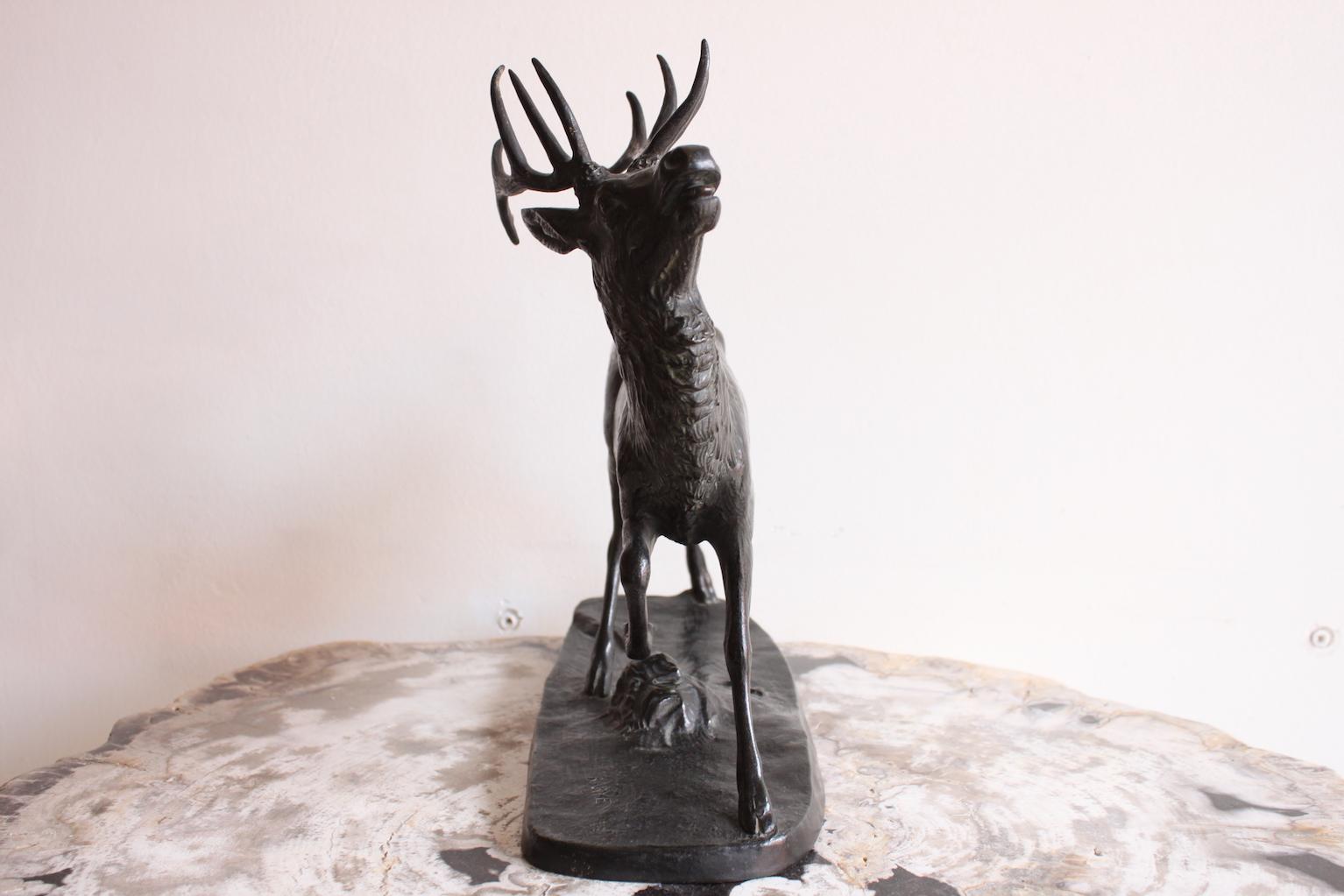 A bronze sculpture of a deer by Antoine Louis Barye, 1850.
Signed and stamped 