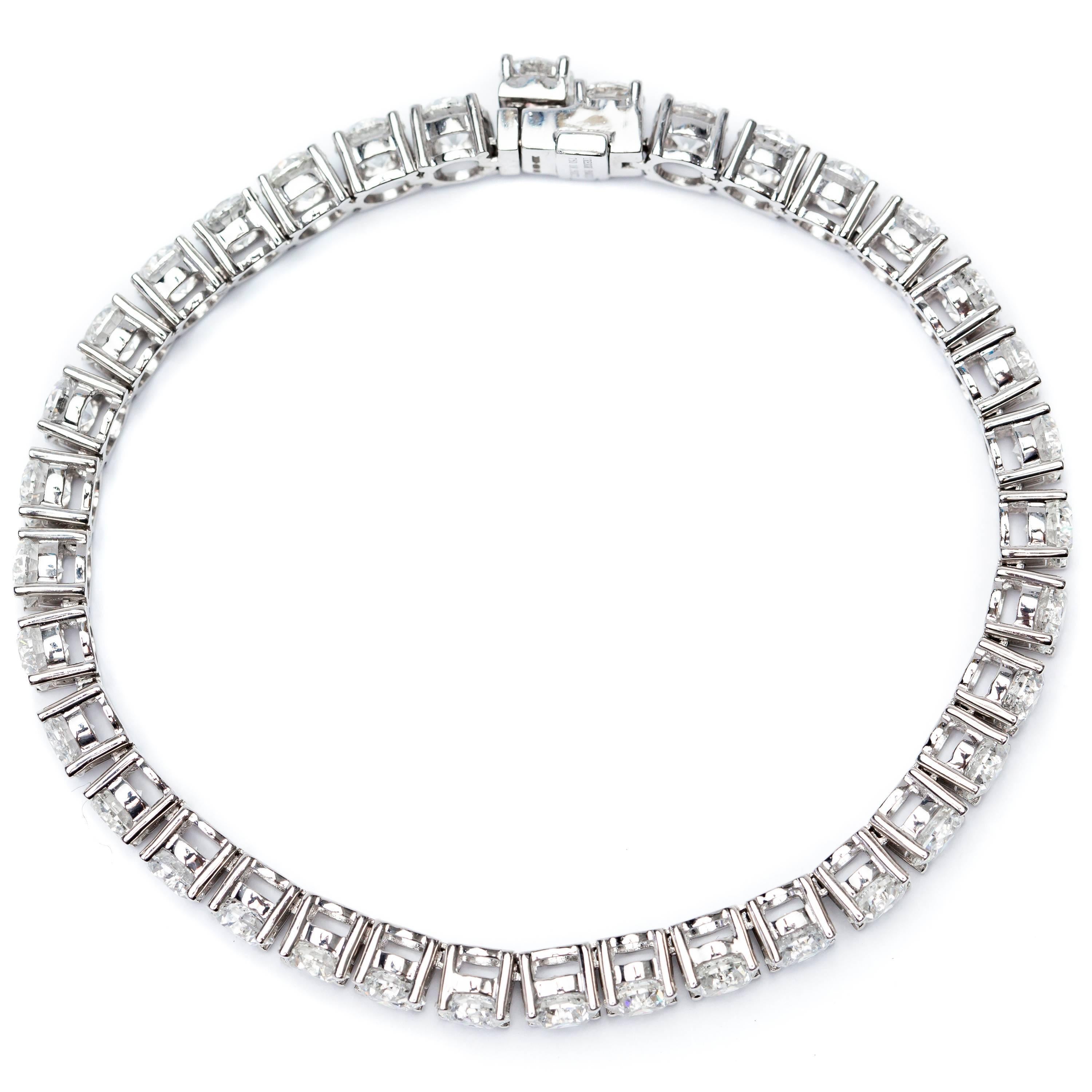 Bespoke 18.50 Carats of spectacular Round Brilliant Cut Diamonds White Color H Clarity SI1 are framed by 18 Karat White Gold for this stunning tennis bracelet. Set in a four claw straight line design with a security clasp. Other Carat sizes