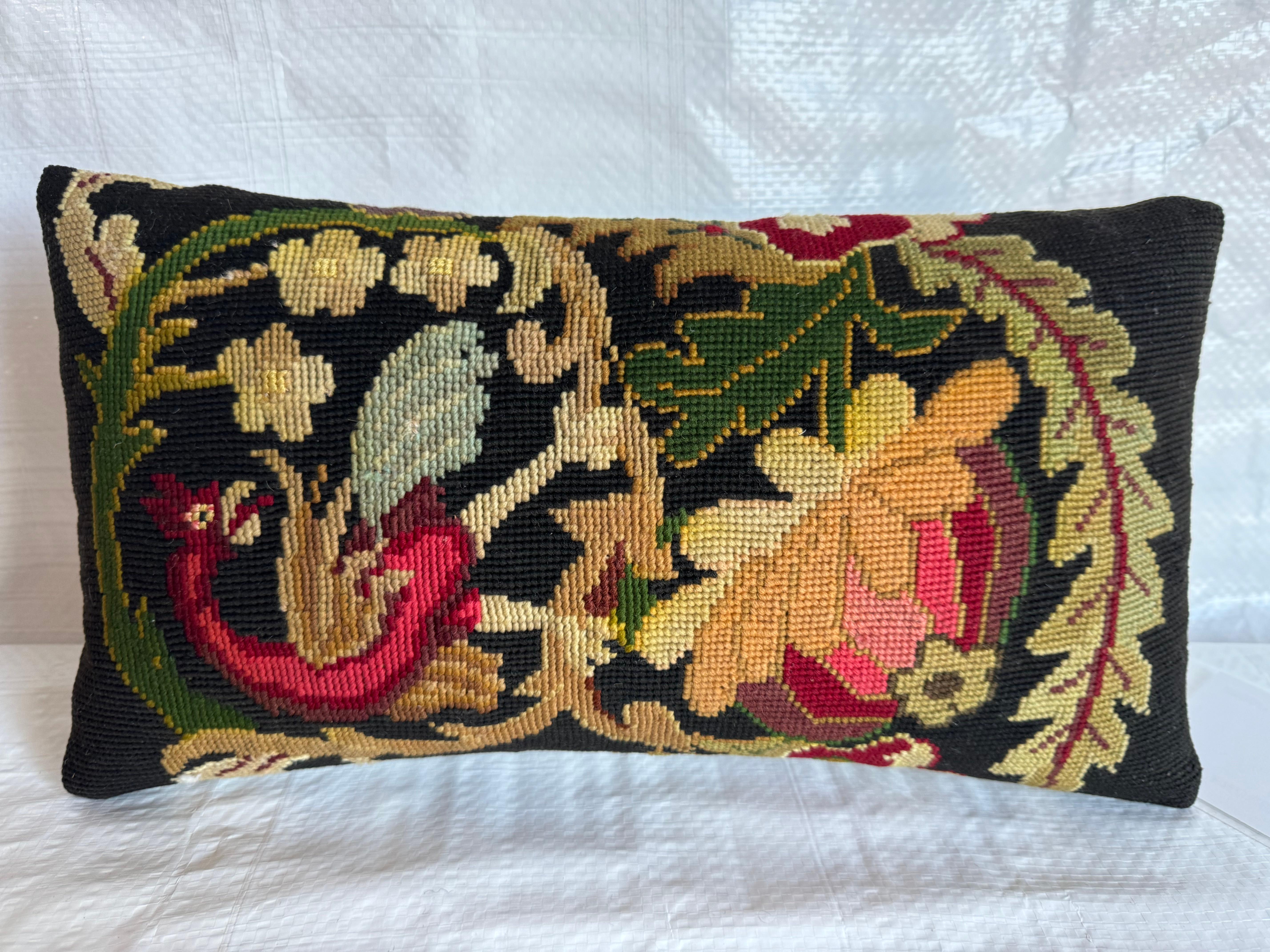 Grace your space with the English Needlework Pillow, a masterpiece measuring 15